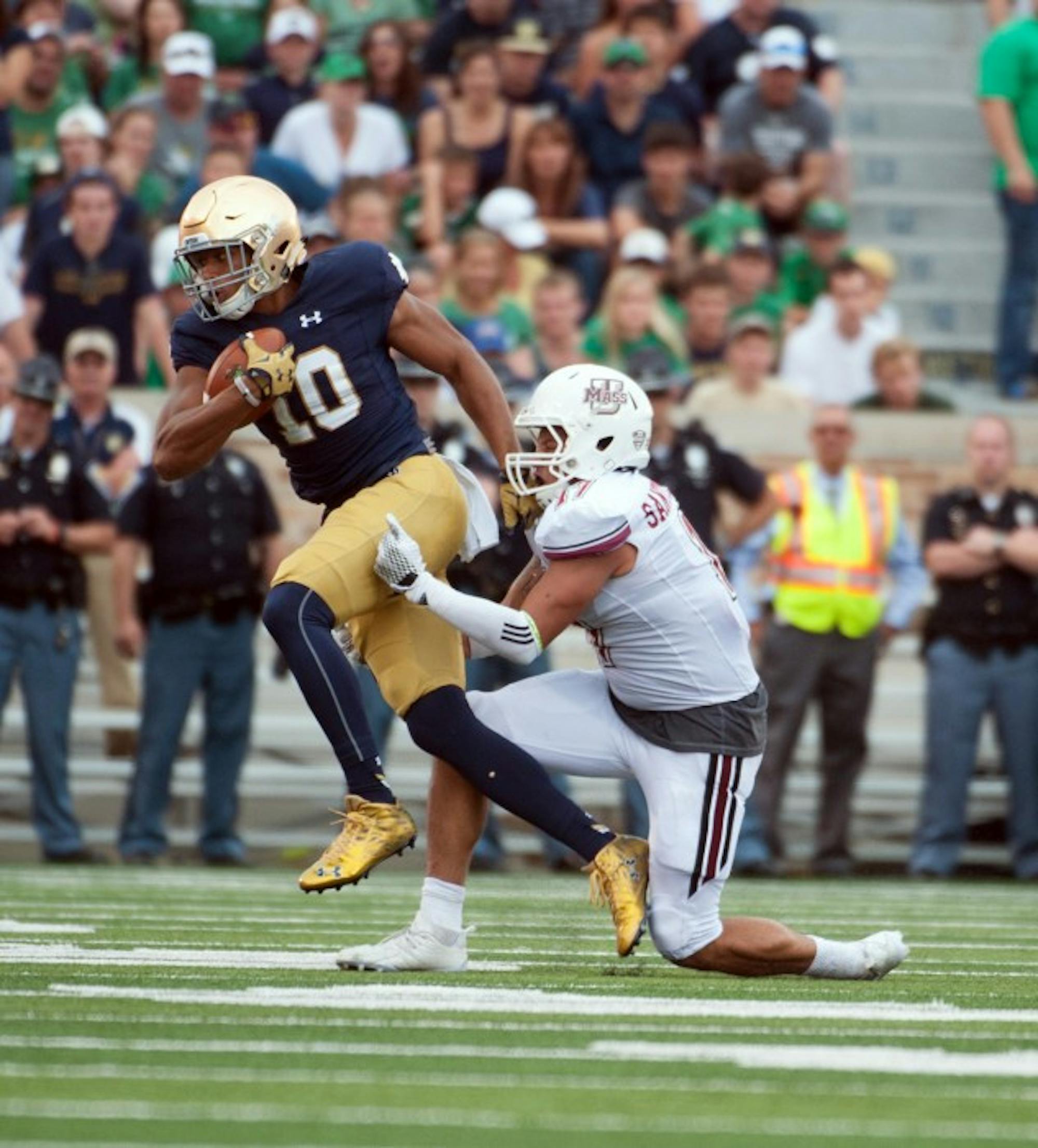 Freshman tight end Alizé Jones sheds a tackle during Notre Dame's 62-27 win over Massachusetts on Saturday at Notre Dame Stadium.