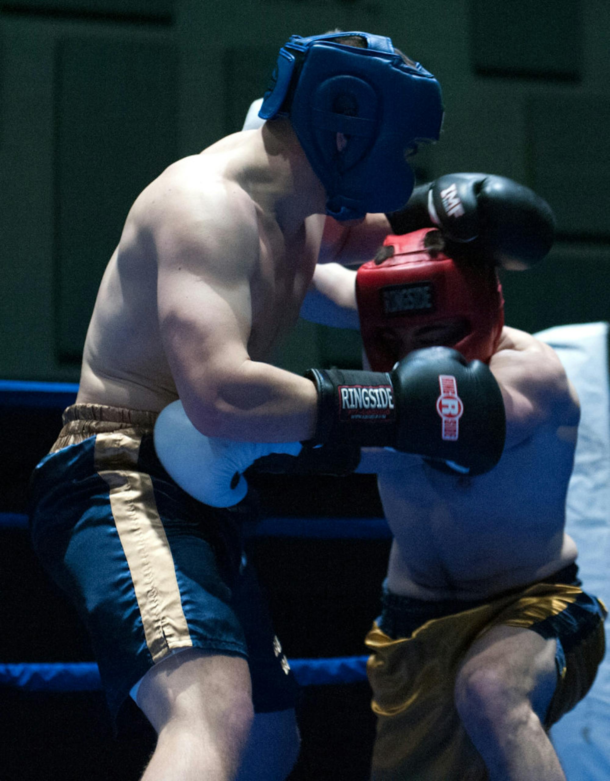 Senior Bryan Cooley, left, defends an attack from graduate student C.J. Pruner during Tuesdays’ 184-pound semifinal bout.