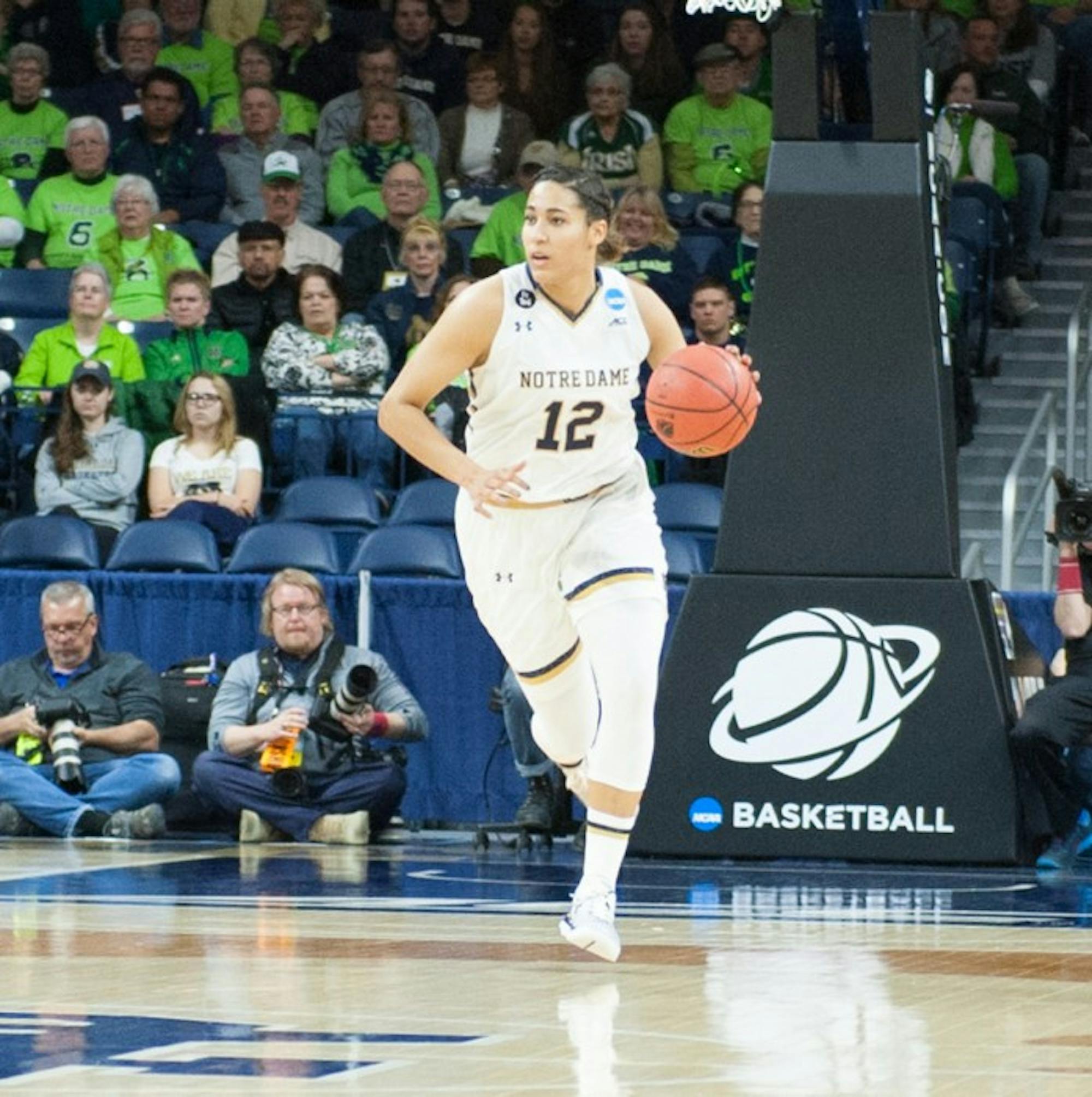Irish sophomore forward Taya Reimer brings the ball up the court during Notre Dame's 79-67 win over DePaul on Sunday at Purcell Pavilion.