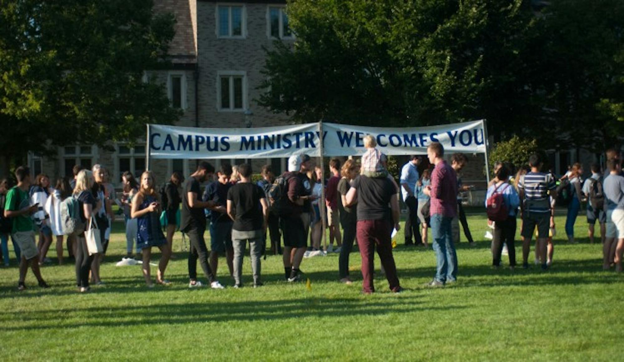 Students attend an introduction to Notre Dame's faith-based groups and clubs hosted by Campus Ministry on South Quad on Wednesday.