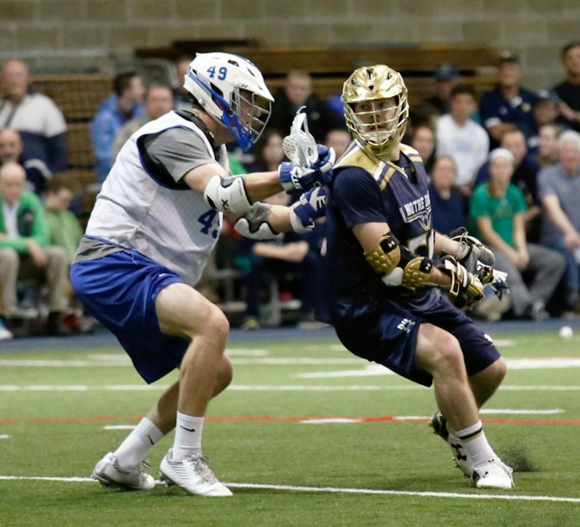 Irish senior attack Matt Kavanagh attempts to shake an Air Force defender during an exhibition game Jan. 30. Kavanagh registered a hat trick for the Irish during their win over Georgetown on Saturday.
