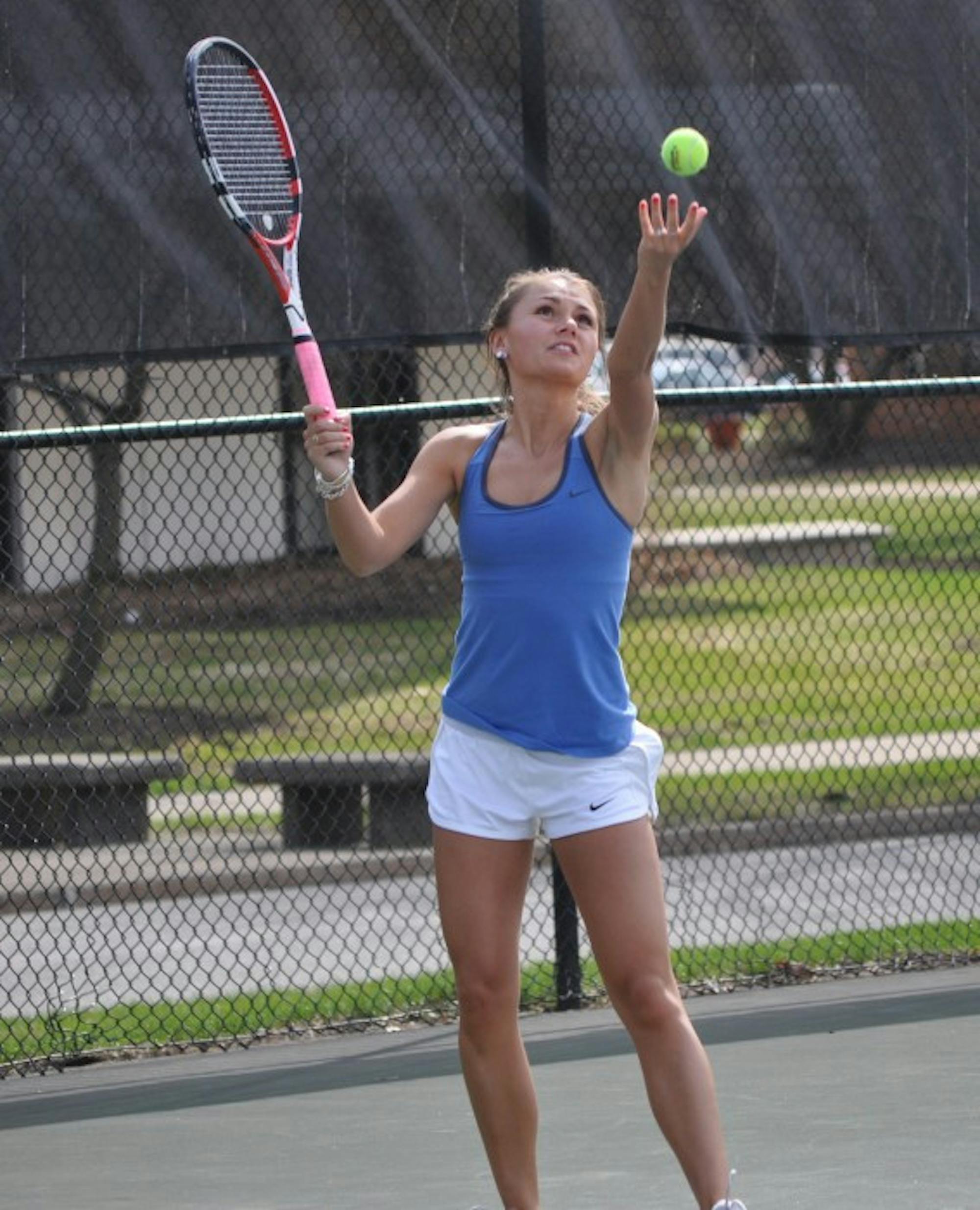 Belles senior Kayle Sexton serves during an 8-1 loss to Hope on April 17, 2014. Sexton is 4-2 over her last six singles matches for the Belles.