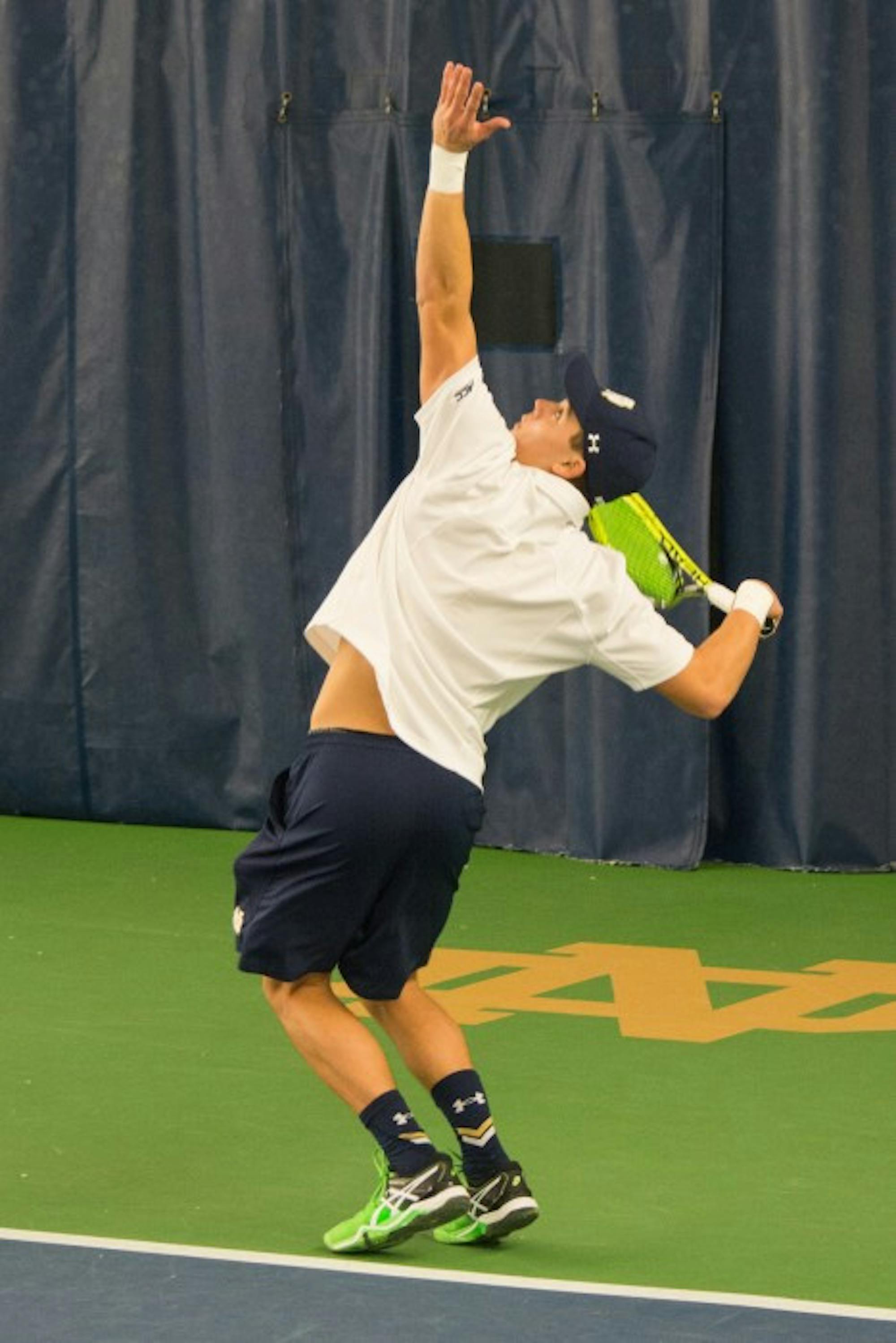 Irish sophomore Brendon Kempin gets ready to hit a serve during a 5-2 win over Indiana at Eck Tennis Pavilion.