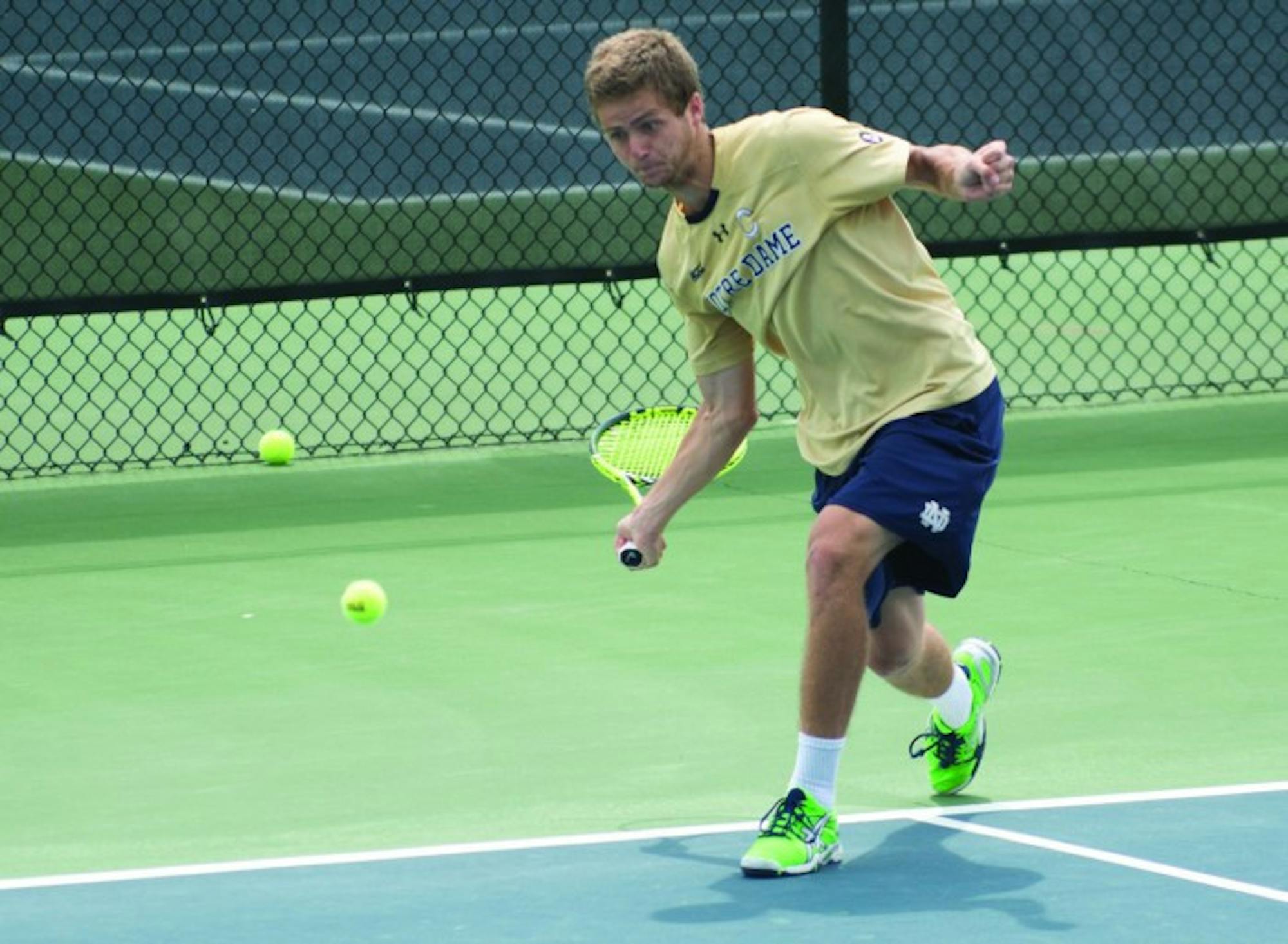 Irish senior Quentin Monaghan goes down after a forehand shot during Notre Dame’s 4-3 win over North Carolina State on April 18 at Courtney Tennis Center.