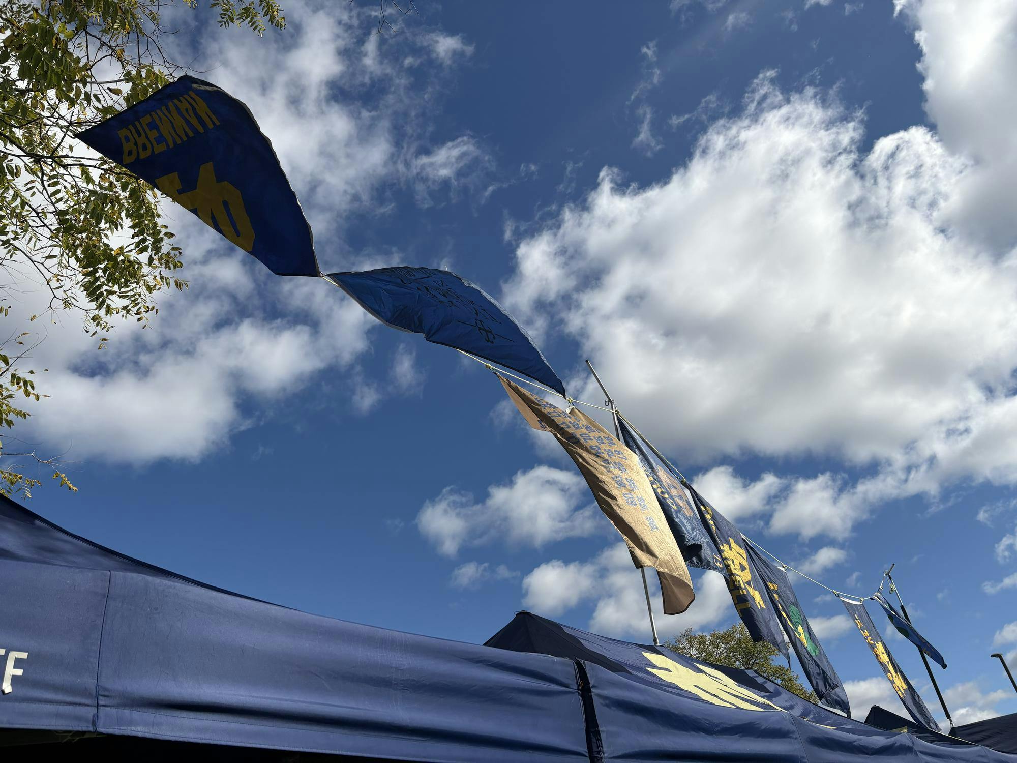 Seven families Notre Dame tailgate flies flags of alumni