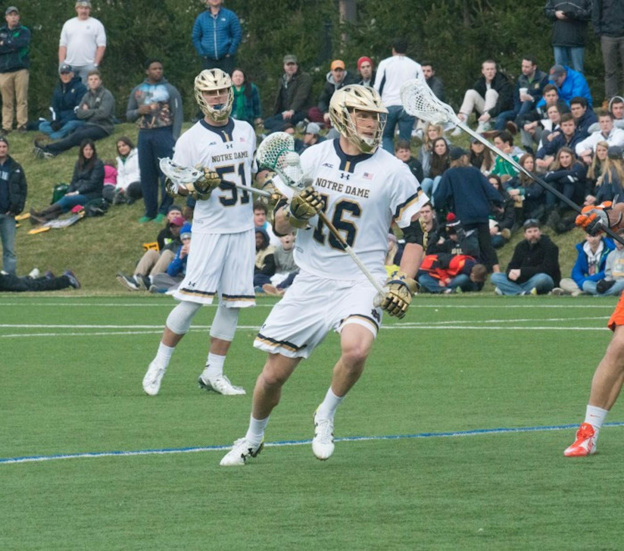 Irish junior midfielder Sergio Perkovic looks to pass the ball during Notre Dame’s 8-7 victory in overtime against Virginia on March 19 at Arlotta Field. Perkovic had three goals during the game.
