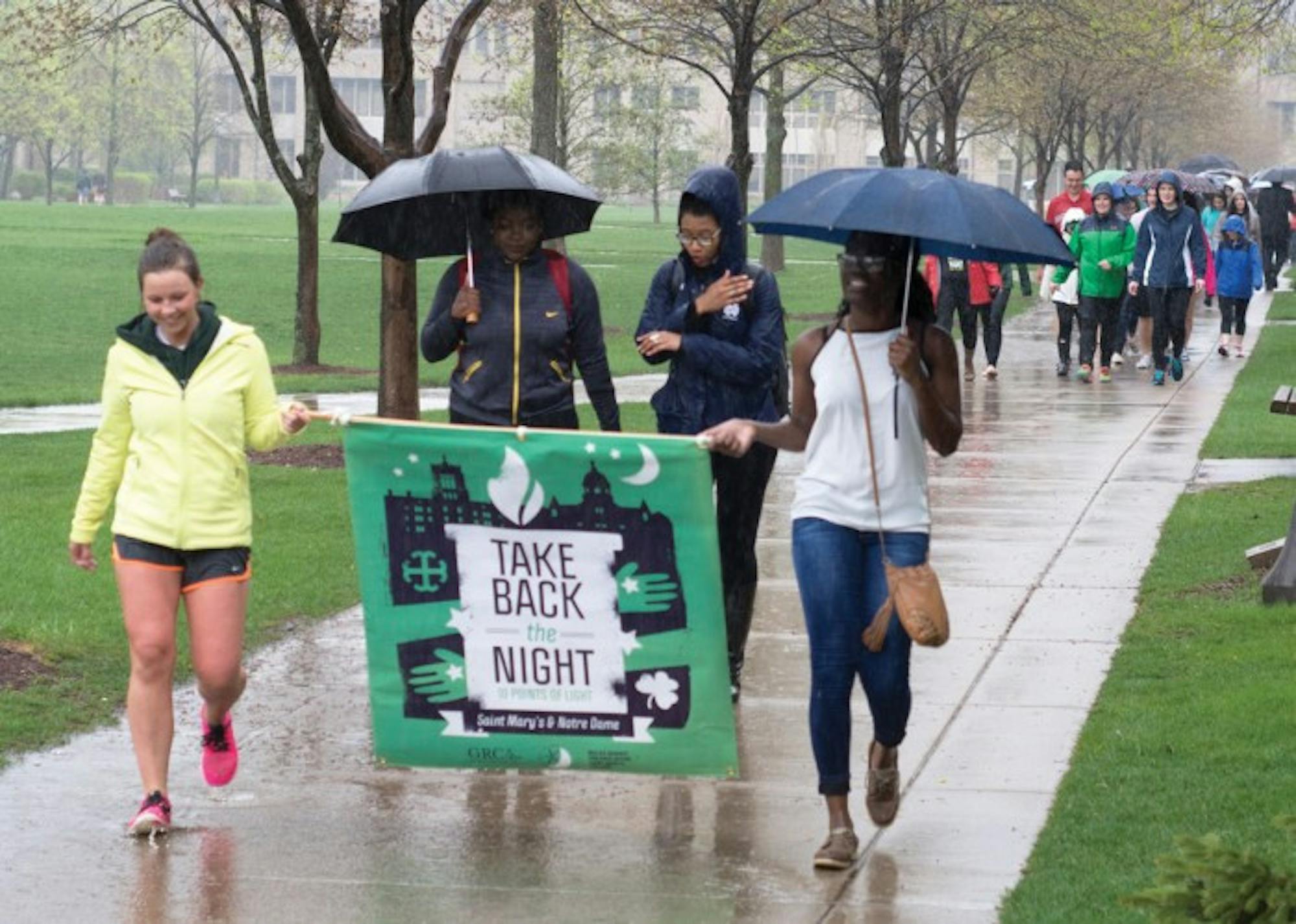 Participants in last year's Take Back the Night event march around campus to raise awareness for issues of sexual assault before ending the night with a prayer vigil at the Grotto.