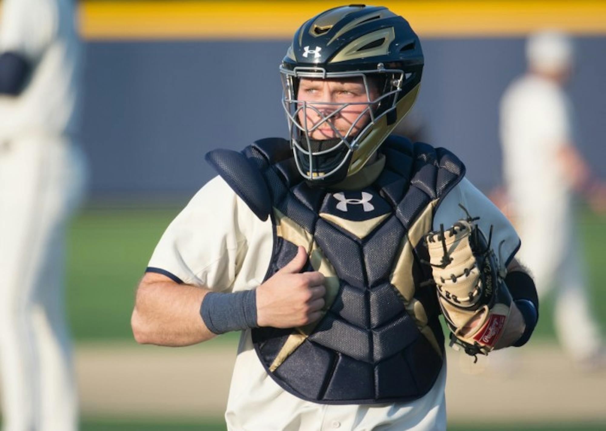 Irish senior catcher Ryan Lidge surveys the diamond during Notre Dame’s 8-3 win over Toledo on April 12 at Frank Eck Stadium. Lidge has drawn 19 walks and has posted a .388 on-base percentage this season.