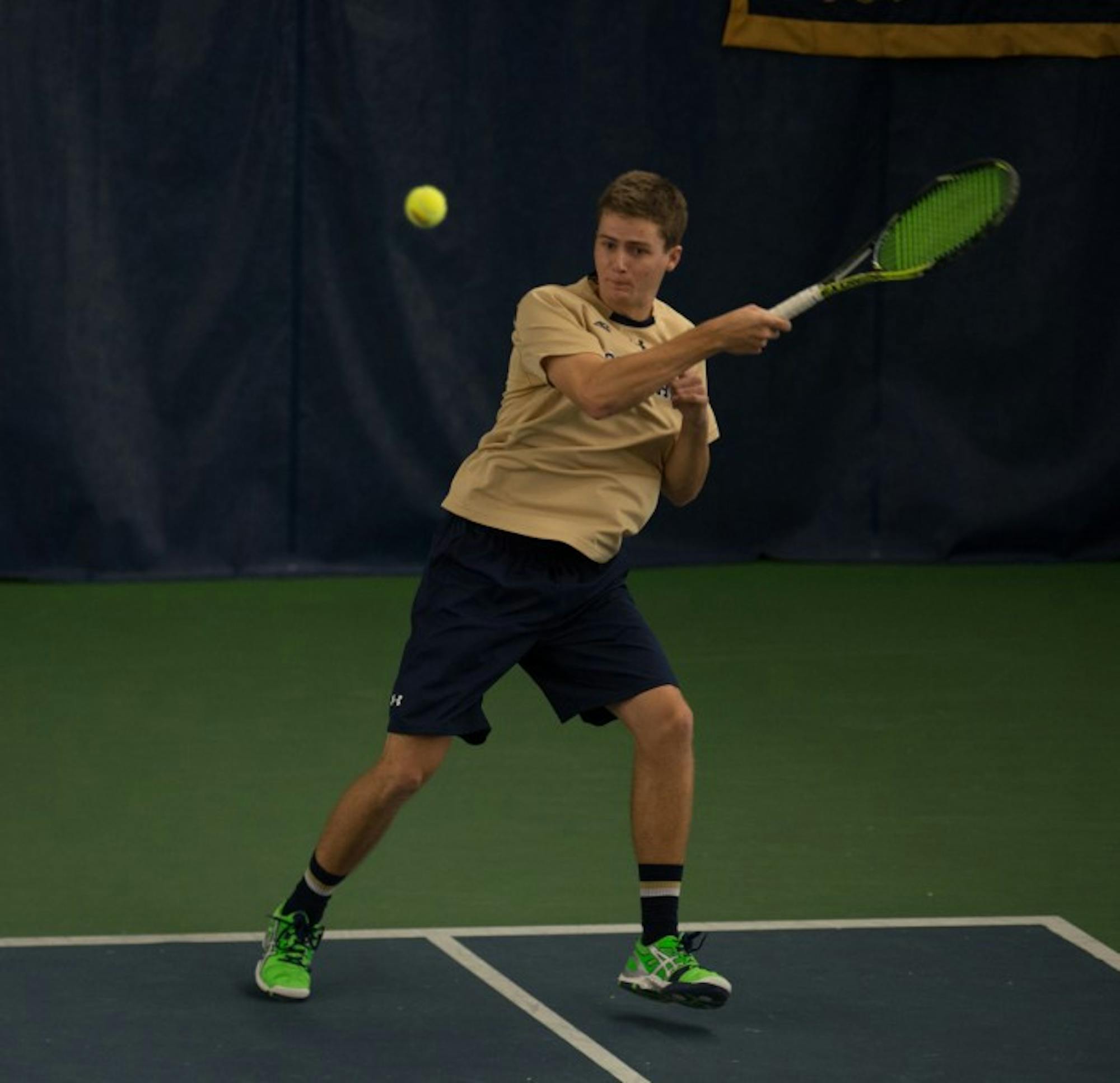 Irish junior Quentin Monaghan hits a backhand in Notre Dame’s 4-3 win over Oklahoma State on Jan. 24 at Eck Tennis Pavilion. Monaghan and junior Eric Schnurrenberger won their doubles match against Ohio State.