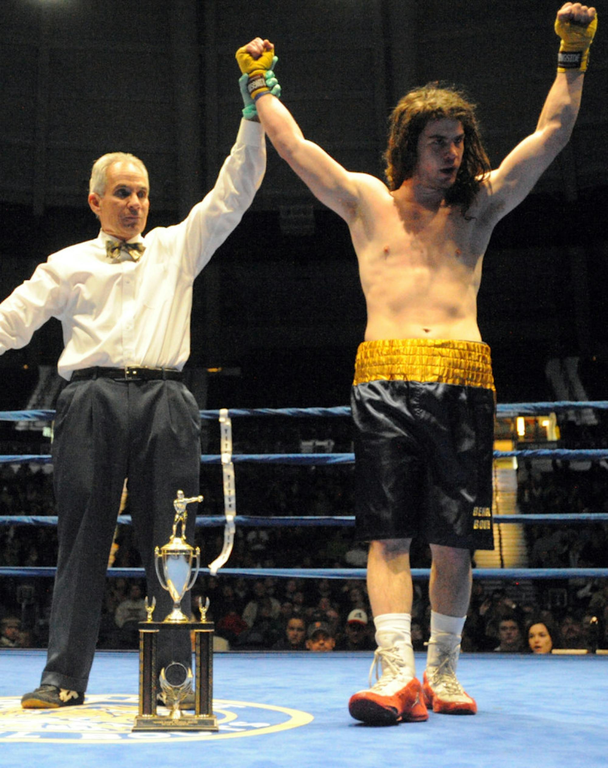Senior Garrity McOsker celebrates after winning the 2014 Bengal Bouts title in the 162-pound weight class.