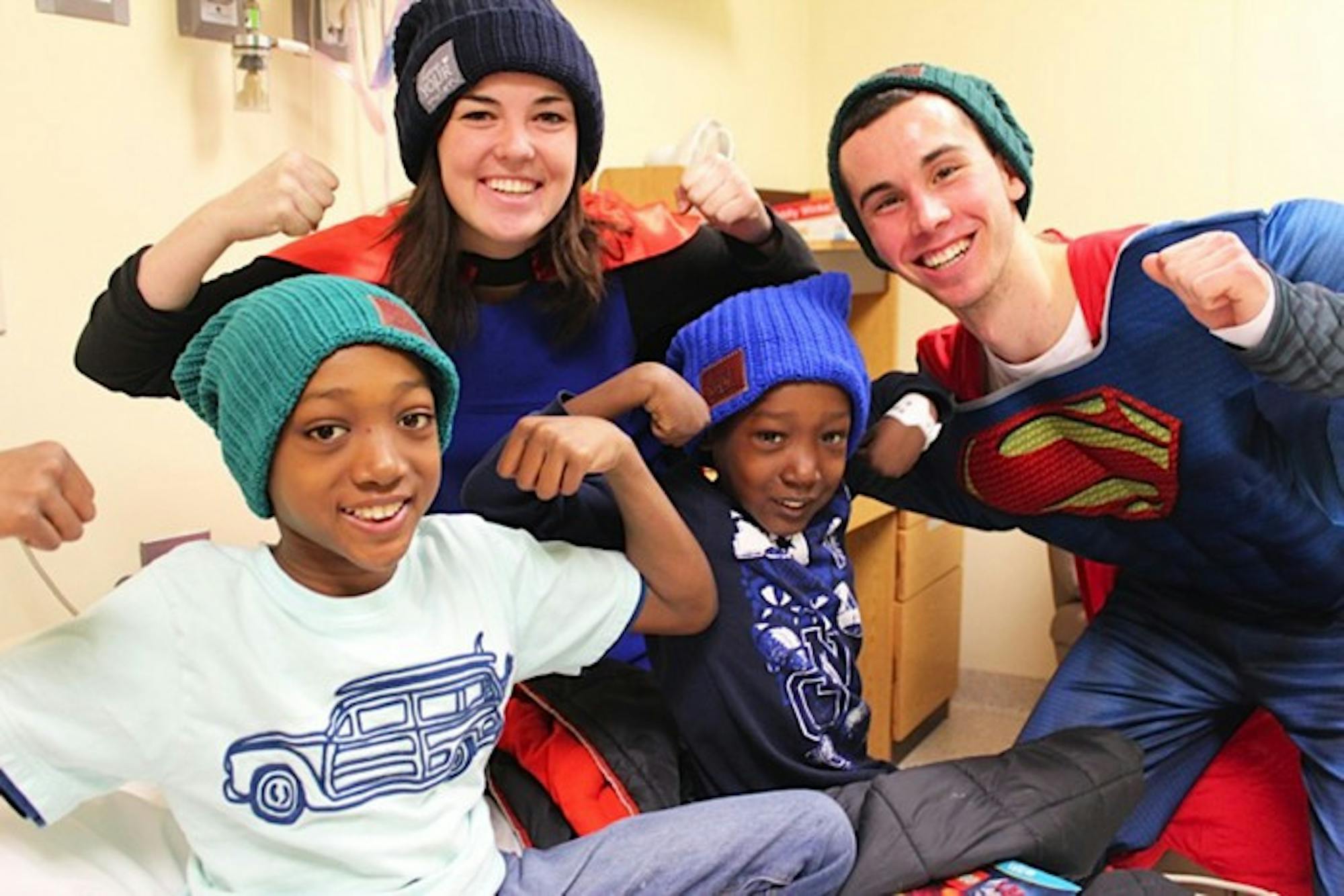 Notre Dame students visit Memorial Hospital in South Bend to give hats to children battling cancer and their families on March 18.
