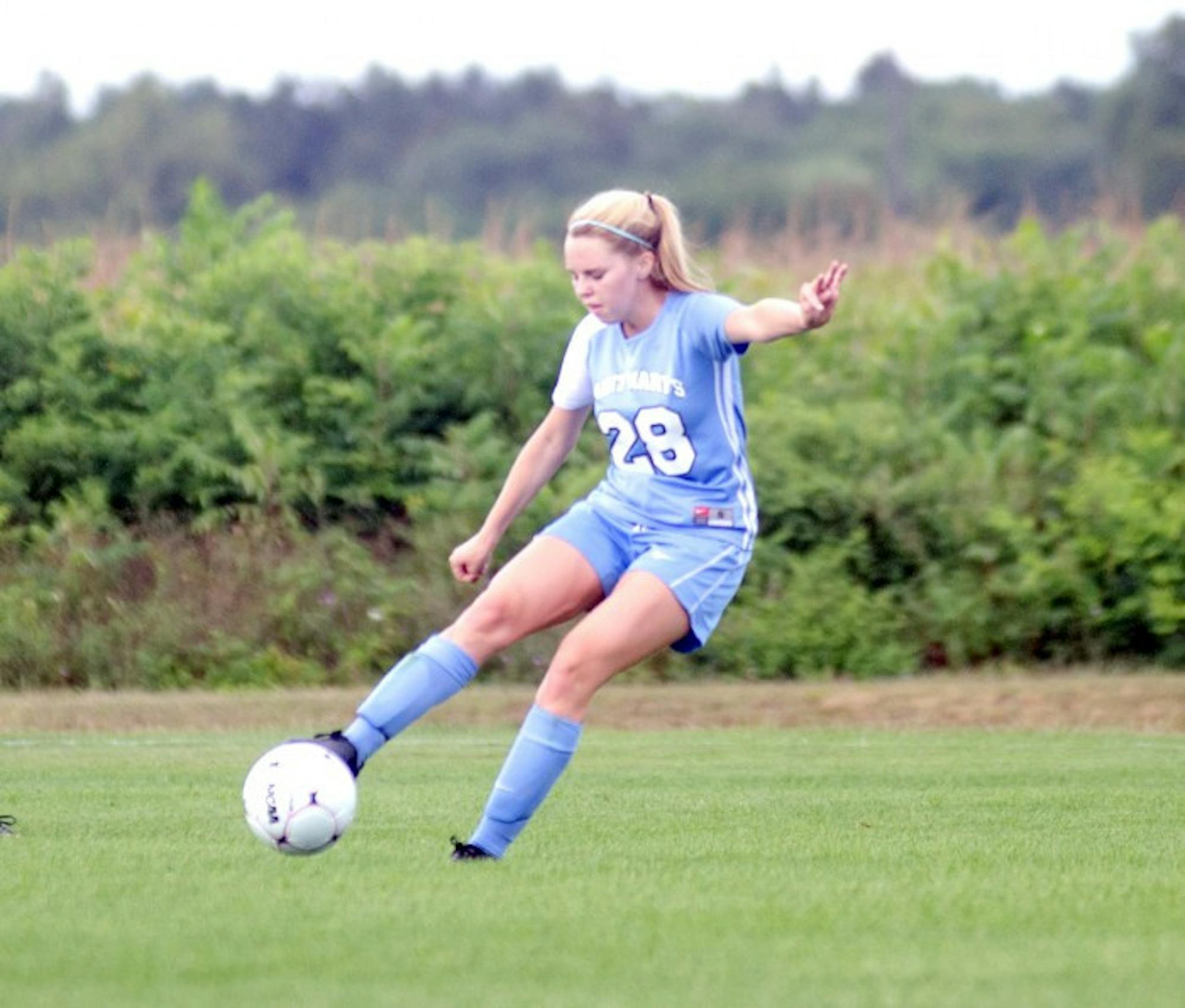 Belles sophomore midfielder Kathryn Lueking connects with the ball during Saint Mary’s 4-1 victory against Illinois Tech on Sept. 2. Lueking started all 20 games for the Belles in 2013.