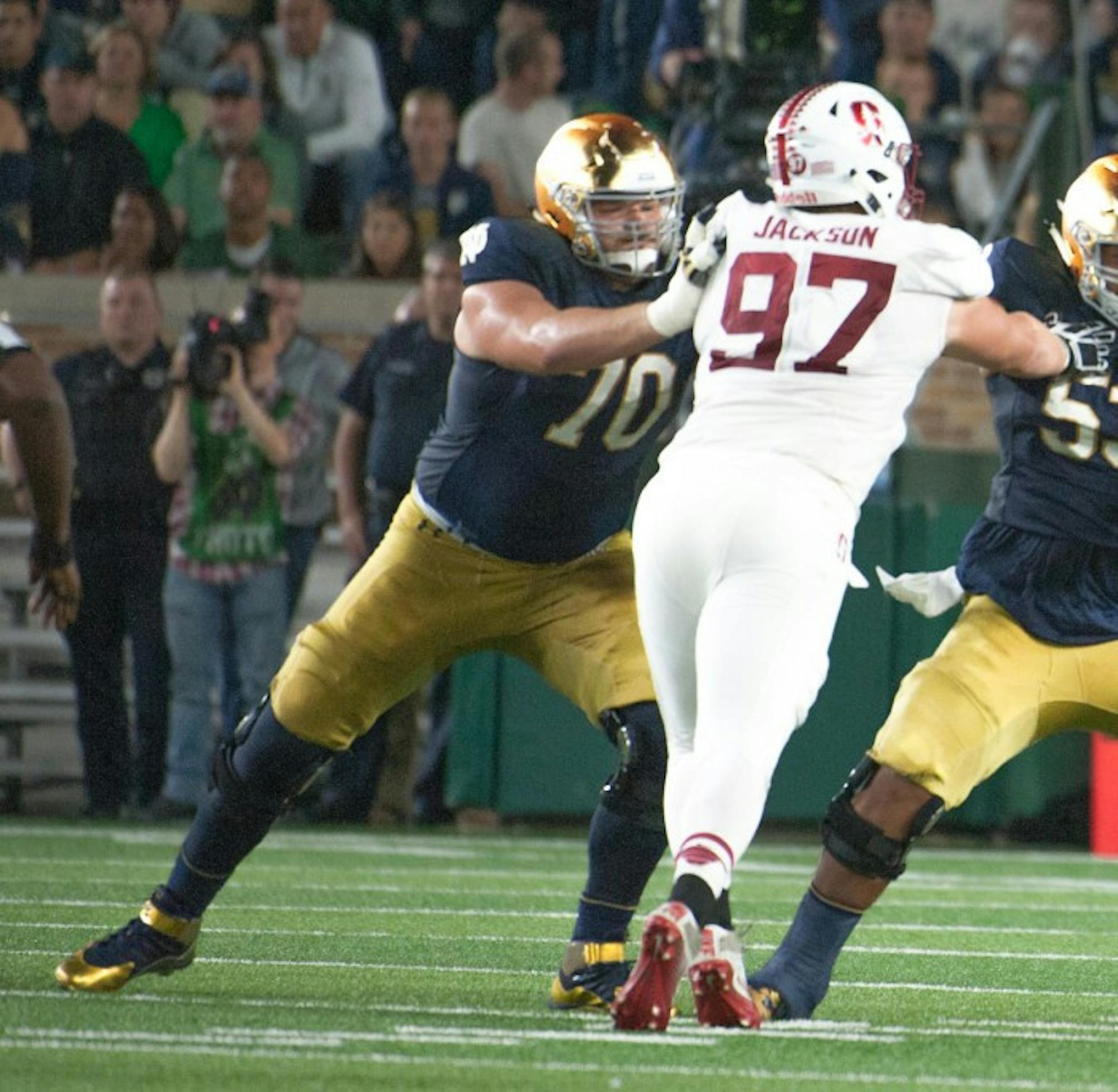 Irish senior offensive lineman Hunter Bivin, left, engages with a Stanford defender during Notre Dame’s loss to Stanford at Notre Dame Stadium. Bivin started his first game of the season against the Cardinal.