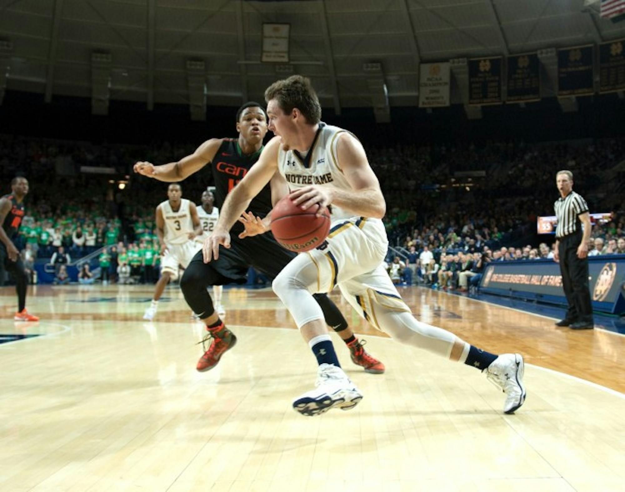 Irish senior guard/forward Pat Connaughton drives past a defender during Notre Dame's 75-70 victory over Miami on Jan. 17 at Purcell Pavilion. Connaughton finished the game with 10 points and 11 rebounds.