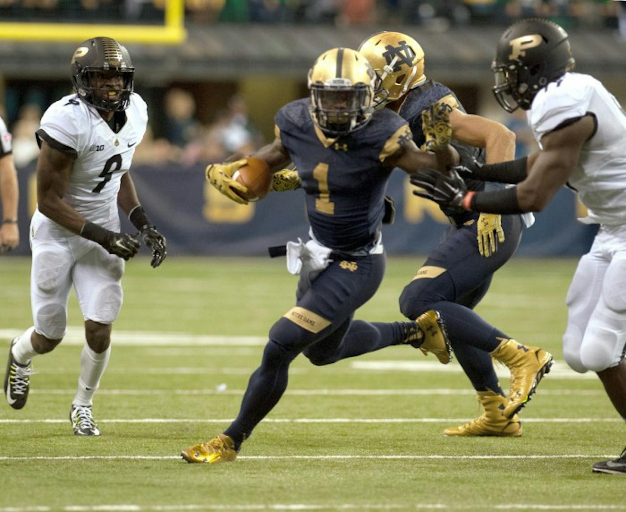 Junior running back Greg Bryant eludes a defender during Notre Dame's 30-14 win over Purdue on Sept. 13. Bryant will miss the entire 2015 season, head coach Brian Kelly said in a statement Tuesday.