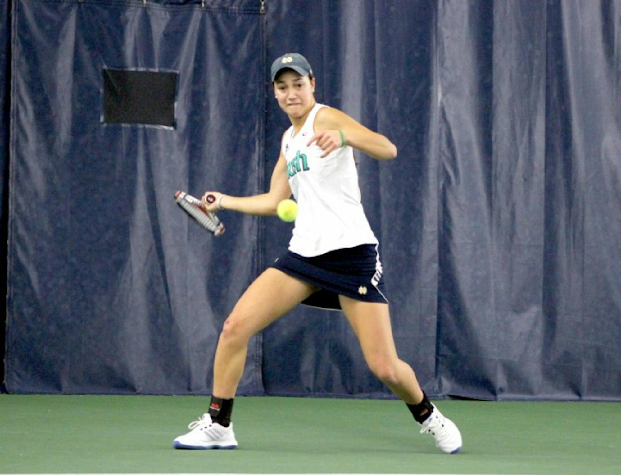 Irish sophomore Quinn Gleason hits a ball during Notre Dame’s 4-3 victory over Indiana in the Eck Tennis Pavilion on Feb. 2. Gleason won both her singles match and doubles match Friday against Duke.