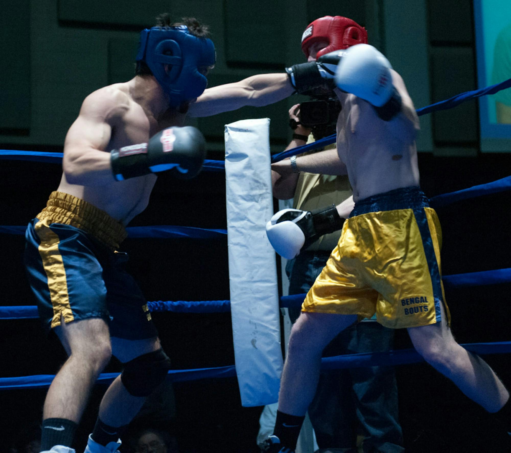 Senior Evan Escobedo, left, throws a punch during Tuesday’s semifinal bouts at Joyce Fieldhouse. Escobedo, the president of Bengal Bouts, lost by unanimous decision to Keough Hall freshman Pat Gordon in the 196-pound weight class. The Fisher Hall resident previously served as a Bengal Bouts captain before becoming president this year.
