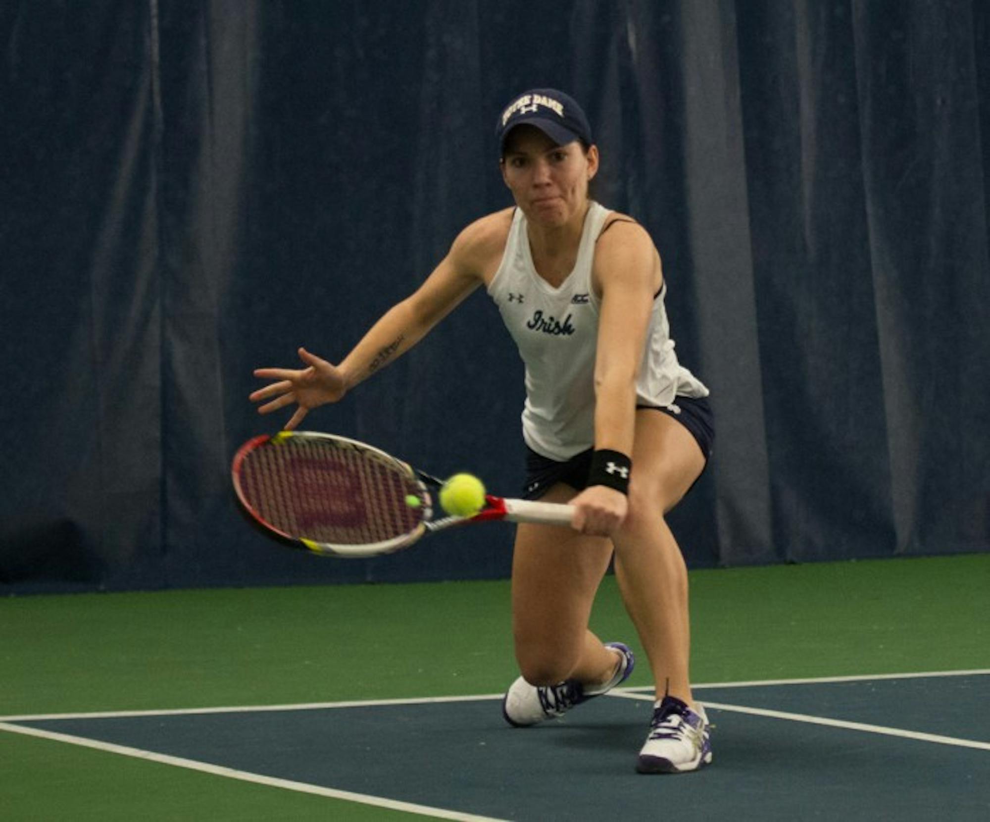 Freshman Allison Miller reaches for a backhand in a 6-1 loss to  Stanford on Feb. 6 at Eck Tennis Pavilion.