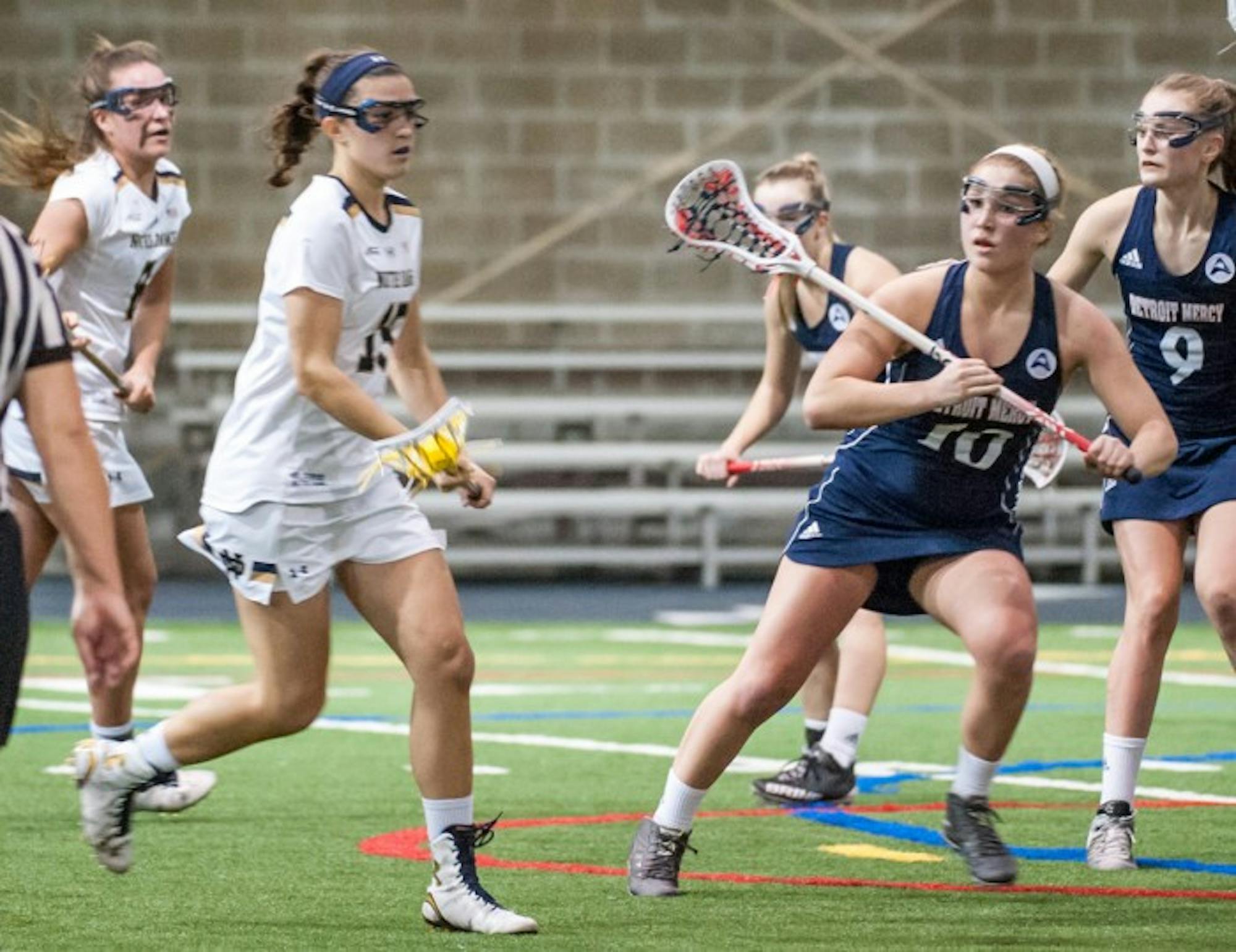 Irish senior attack Cortney Fortunato cradles the ball and surveys the field during Notre Dame’s 24-9 win over Detroit on Feb. 11 at Loftus Sports Center. Fortunato scored six goals and added four assists in the win.
