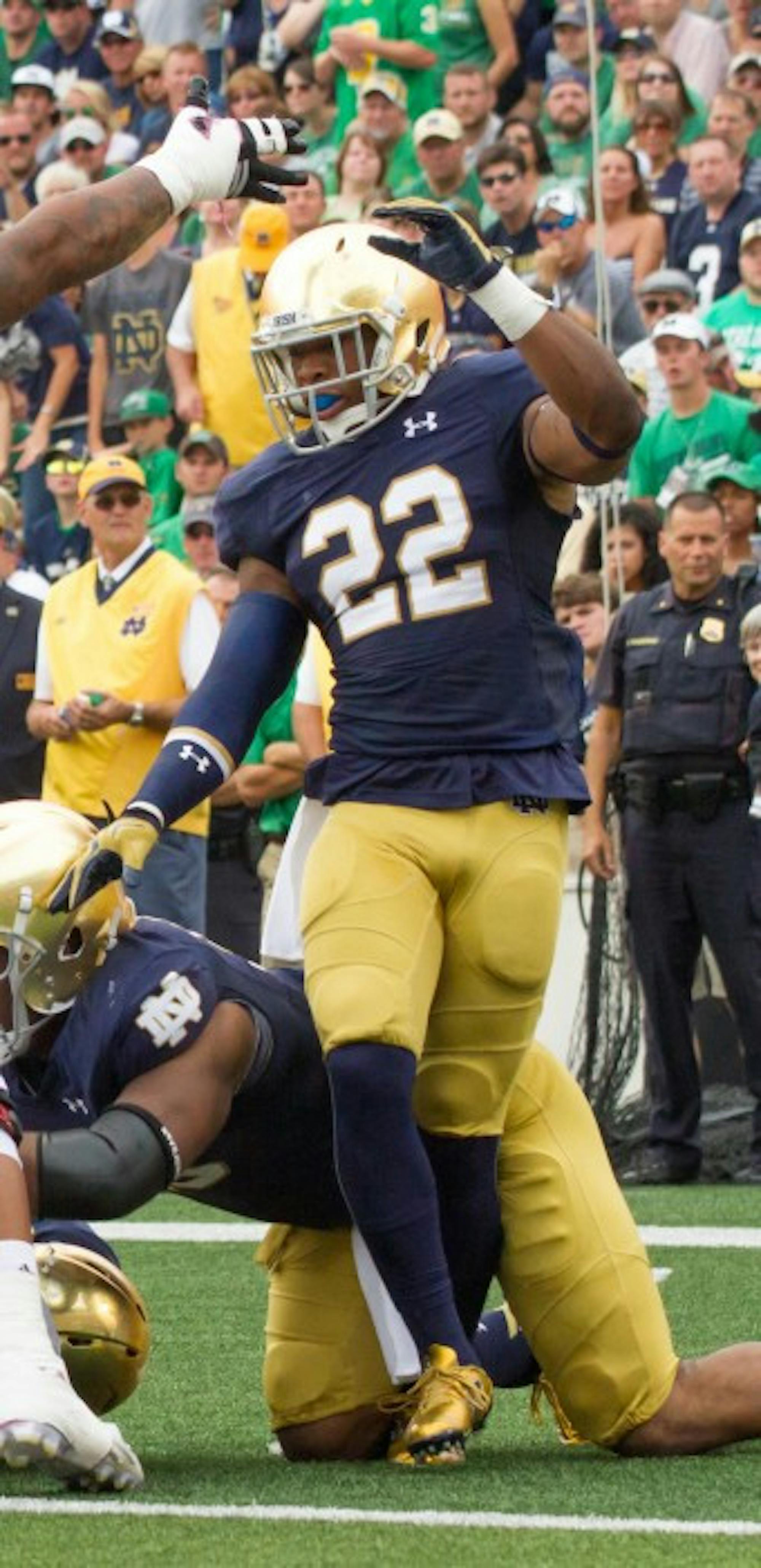 Irish senior safety Elijah Shumate reacts to a goal-line stand during Notre Dame’s 62-27 home victory over Massachusetts on Sept. 26.