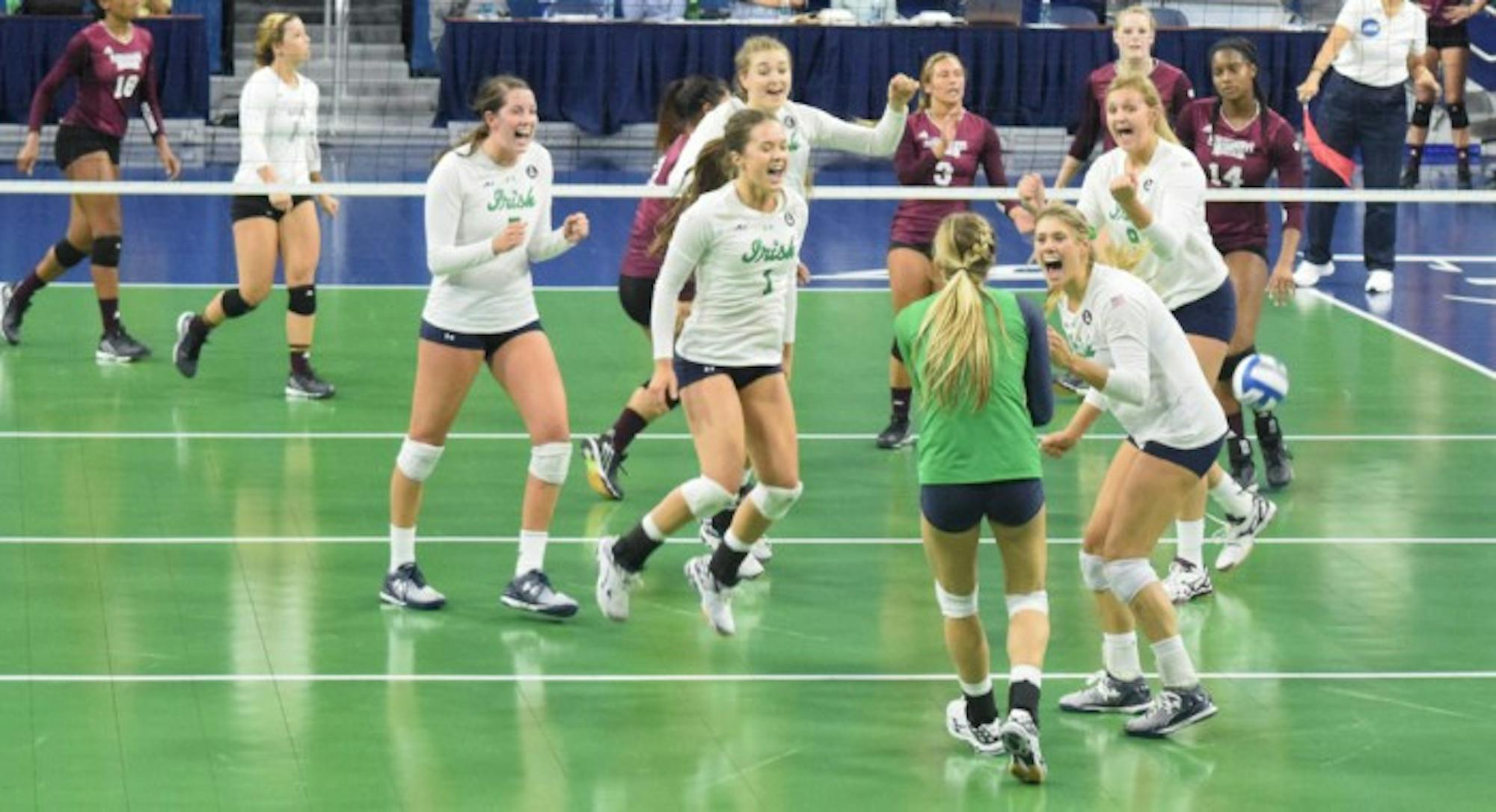 The Irish volleyball team celebrates a win against Mississippi State on Friday at Purcell Pavillion. The team won two of its three matches in the Golden Dome Invitational last weekend.