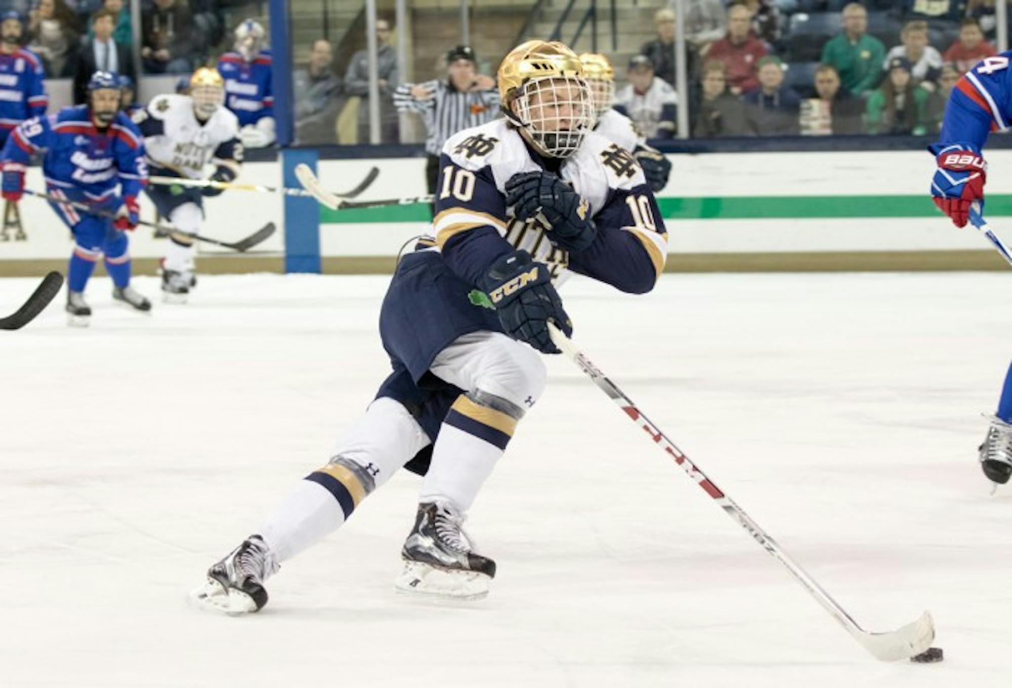 Irish junior forward Anders Bjork skates up the ice with the puck during Notre Dame’s 4-1 loss to UMass Lowell on Nov. 17 at Compton Family Ice Arena.