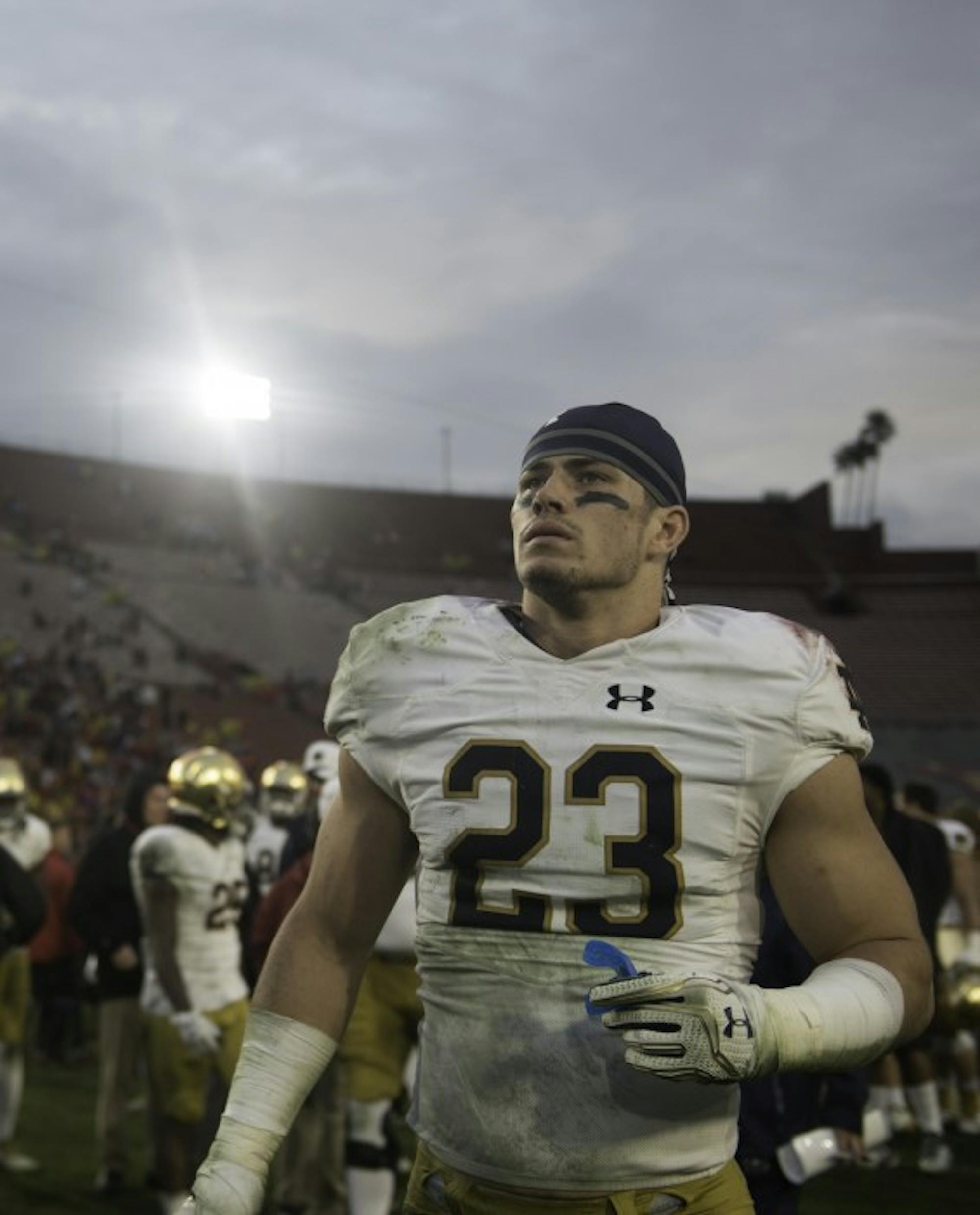 Irish senior safety Drue Tranquill walks off the field after Notre Dame’s 45-27 loss to USC on Nov. 26 at Los Angeles Coliseum.