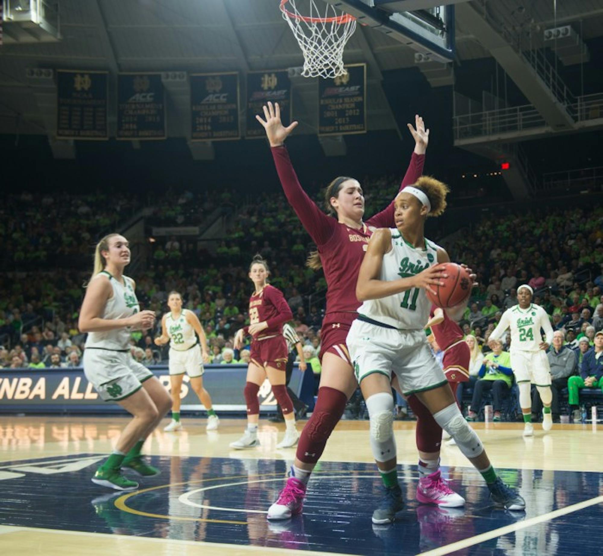 Junior forward Brianna Turner spins around a defender on the baseline during Notre Dame’s 82-45 win over Boston College on Thursday at Purcell Pavilion.
