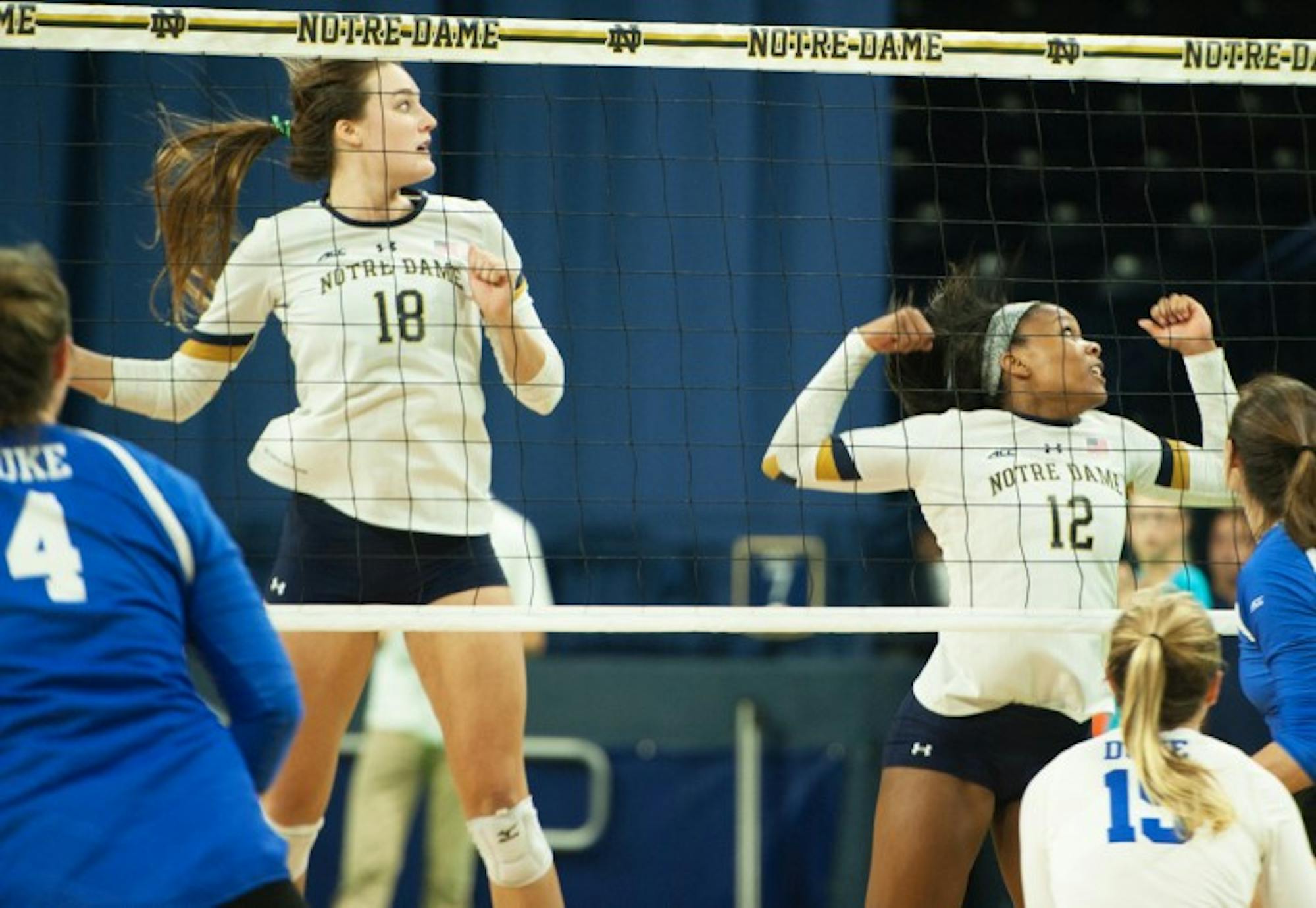 Senior Katie Higgins and freshman Jemma Yeadon prepare to block a spike during Notre Dame’s 3-1 victory over Duke on Sept. 30.