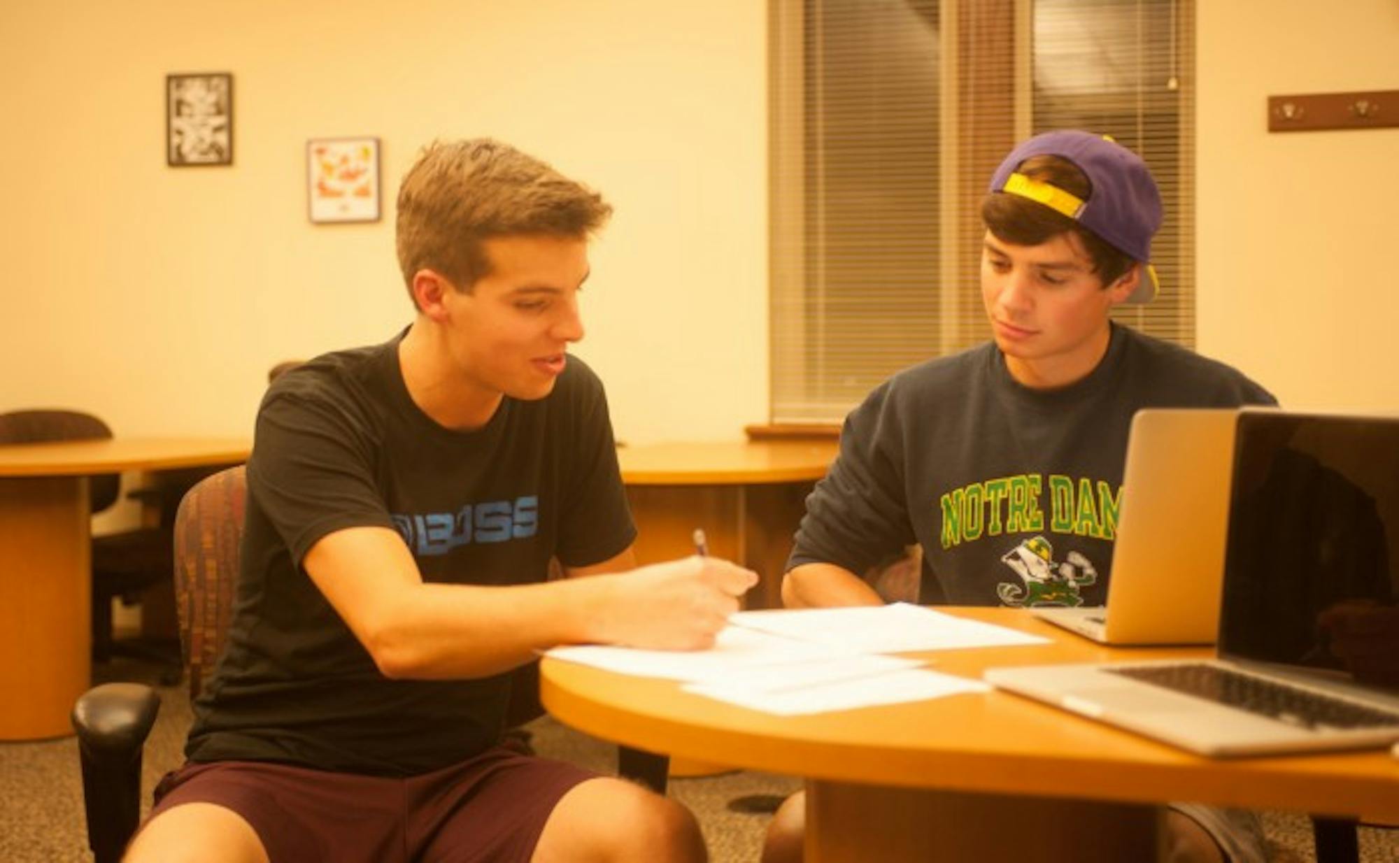 A student consults with a tutor in the Coleman-Morse location of the Writing Center.