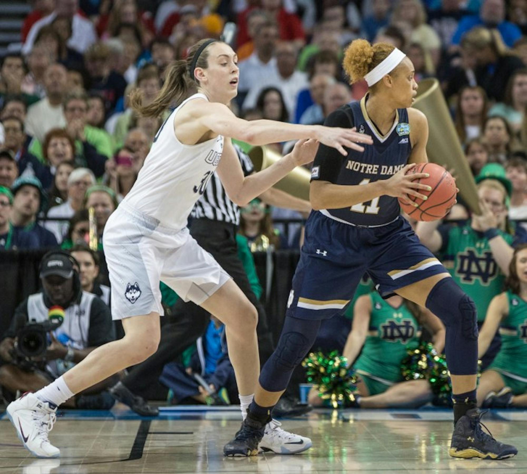 Sophomore forward Brianna Turner turns away from UConn defender Breanna Stewart during Notre Dame’s 63-53 loss in the national title game April 7 at Amalie Arena in Tampa, Florida.