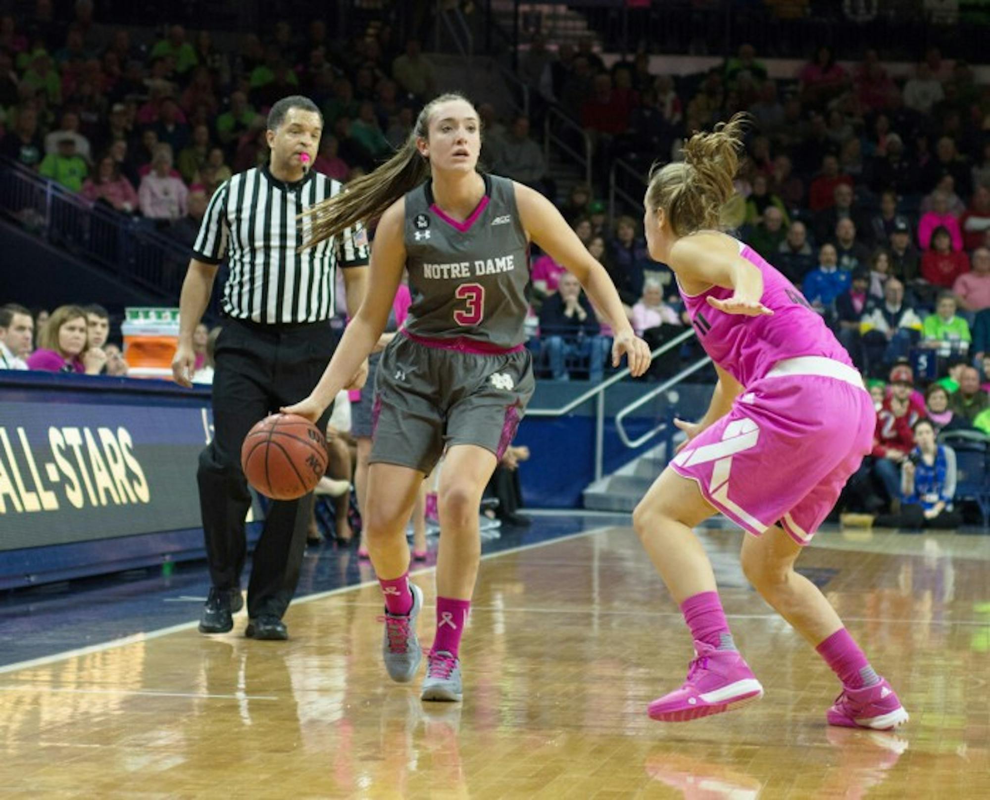 Irish freshman guard Marina Mabrey looks for a passing lane during Notre Dame’s 90-69 victory over Miami on Feb. 13 at Purcell Pavilion. Mabrey scored 14 points and grabbed six rebounds in the game, and for the season the freshman is averaging 11.4 points per game.