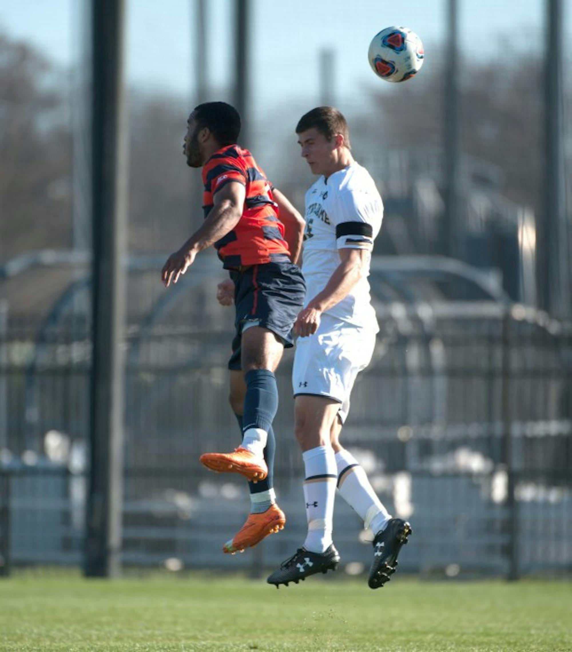 Senior midfielder Evan Panken jumps for a header in Notre Dame’s 1-0 loss to Syracuse on Sunday in the ACC title game.