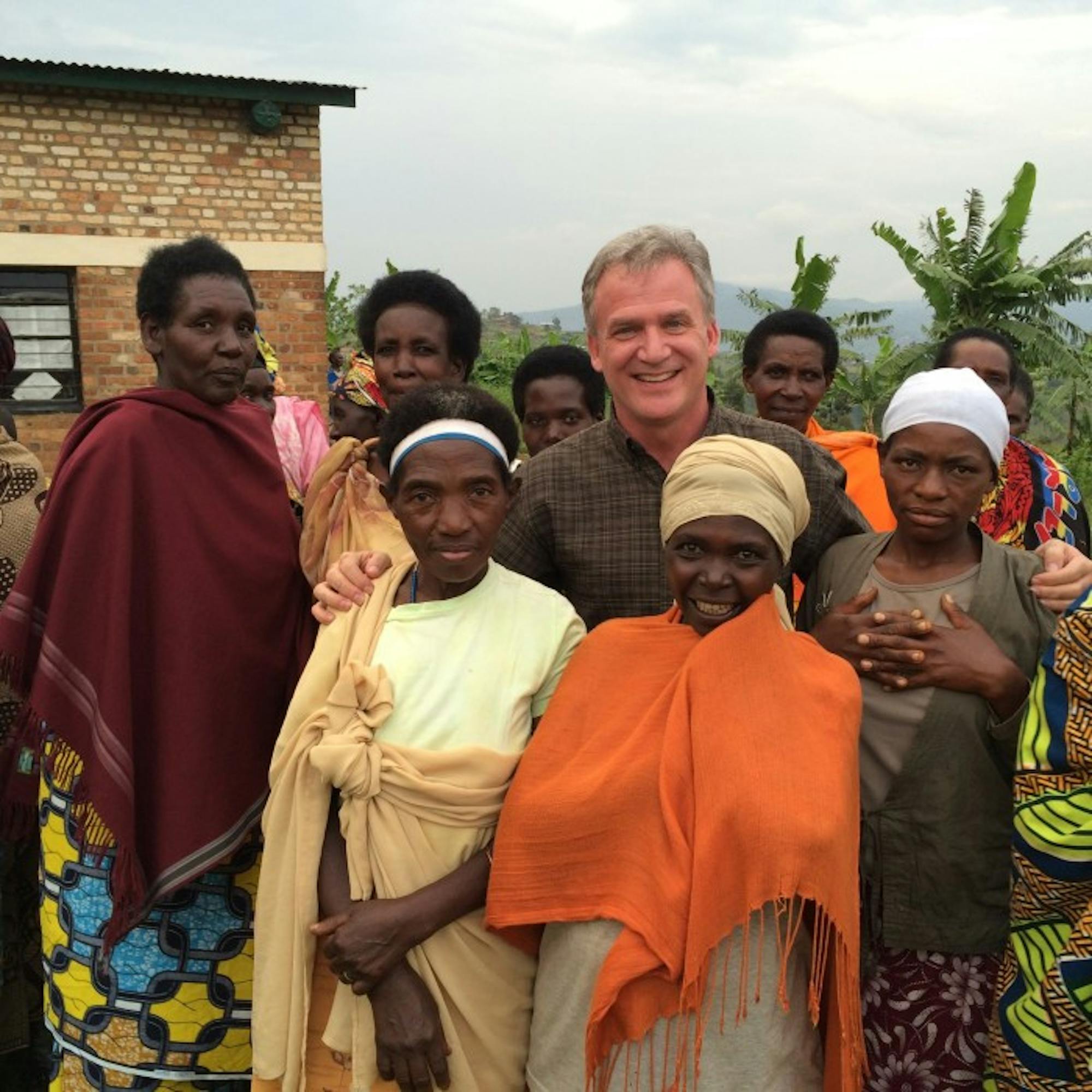 Fr. Dan Groody stands with survivors of the 1994 Rwandan genocide in December. While in Rwanda, Groody visited victims’ memorials and met with community leaders seeking to rebuild their country.