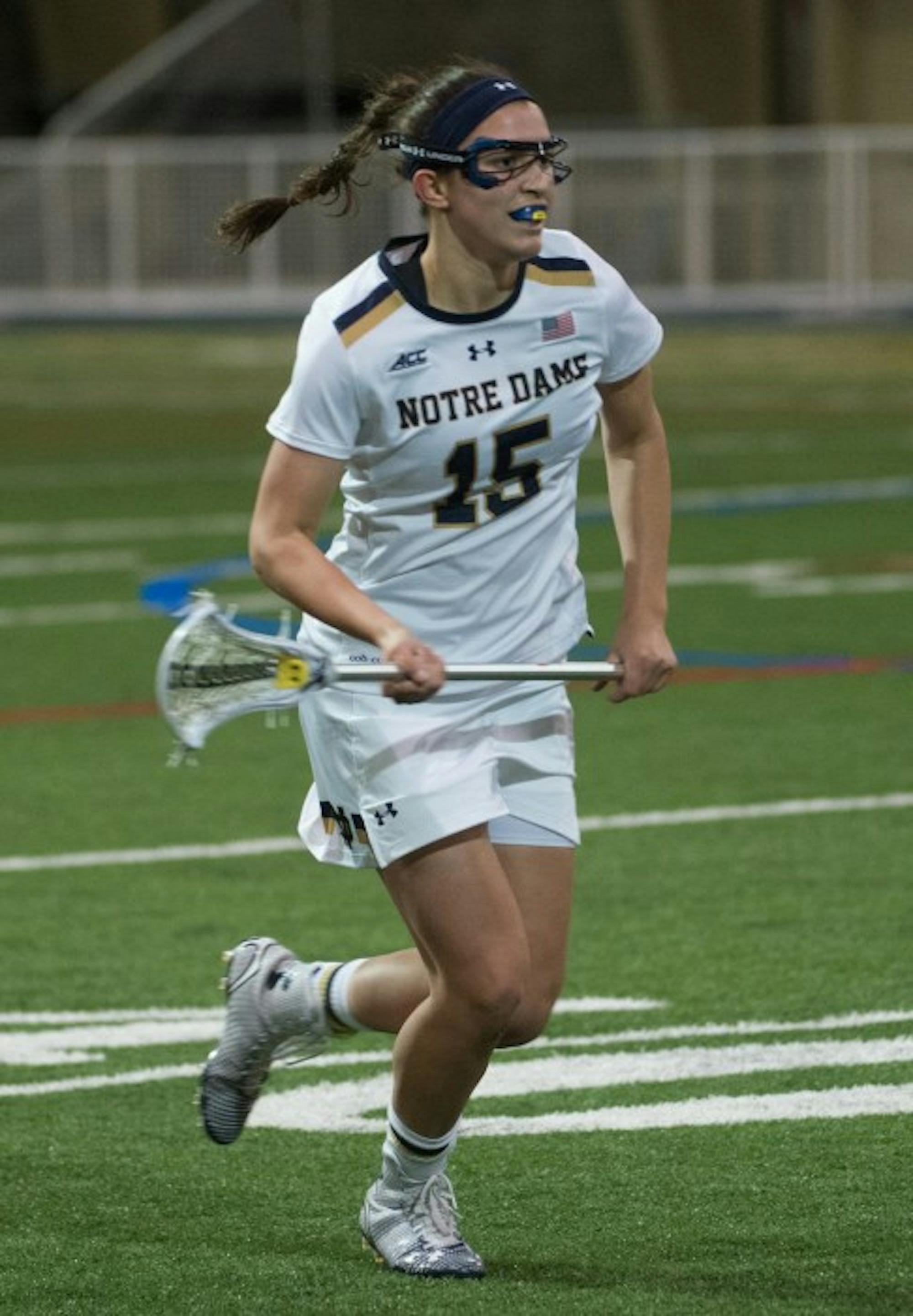 Irish sophomore attack Cortney Fortuno surverys the field in an 17-5 victory against Detroit  on Feb. 15 at Loftus Sports Center. Fortunado has 42 goals and 14 assists this season.