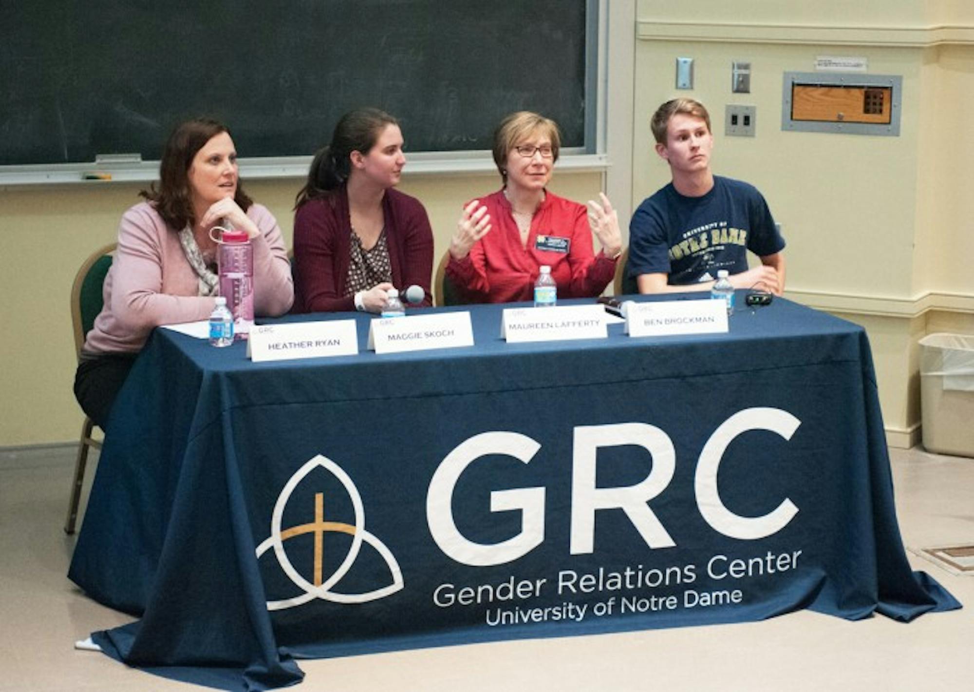 Panelists gather in DeBartolo Hall on Wednesday night to teach students how to identify and cope with unhealthy relationships. The speakers confronted issues such as stalking and emotional abuse.