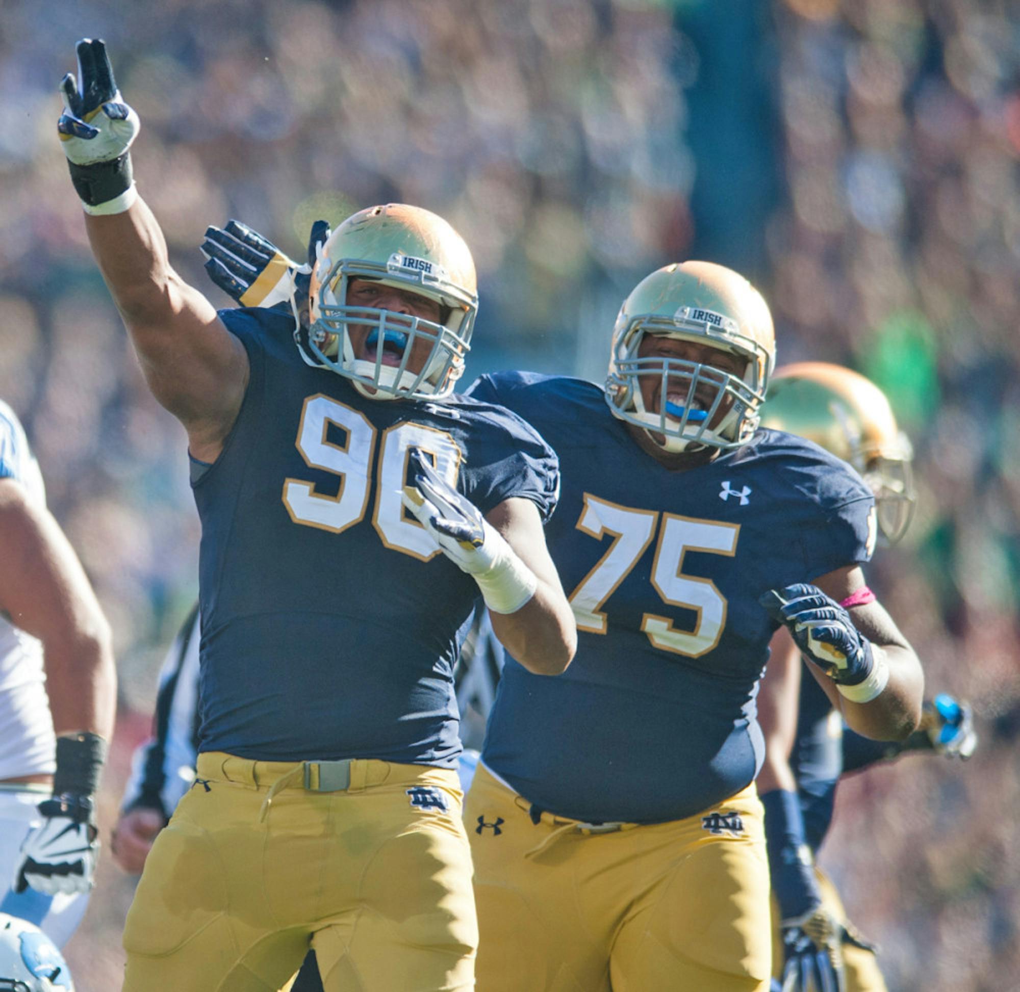 Irish sophomore defensive lineman Isaac Rochell celebrates during Notre Dame’s win Saturday.