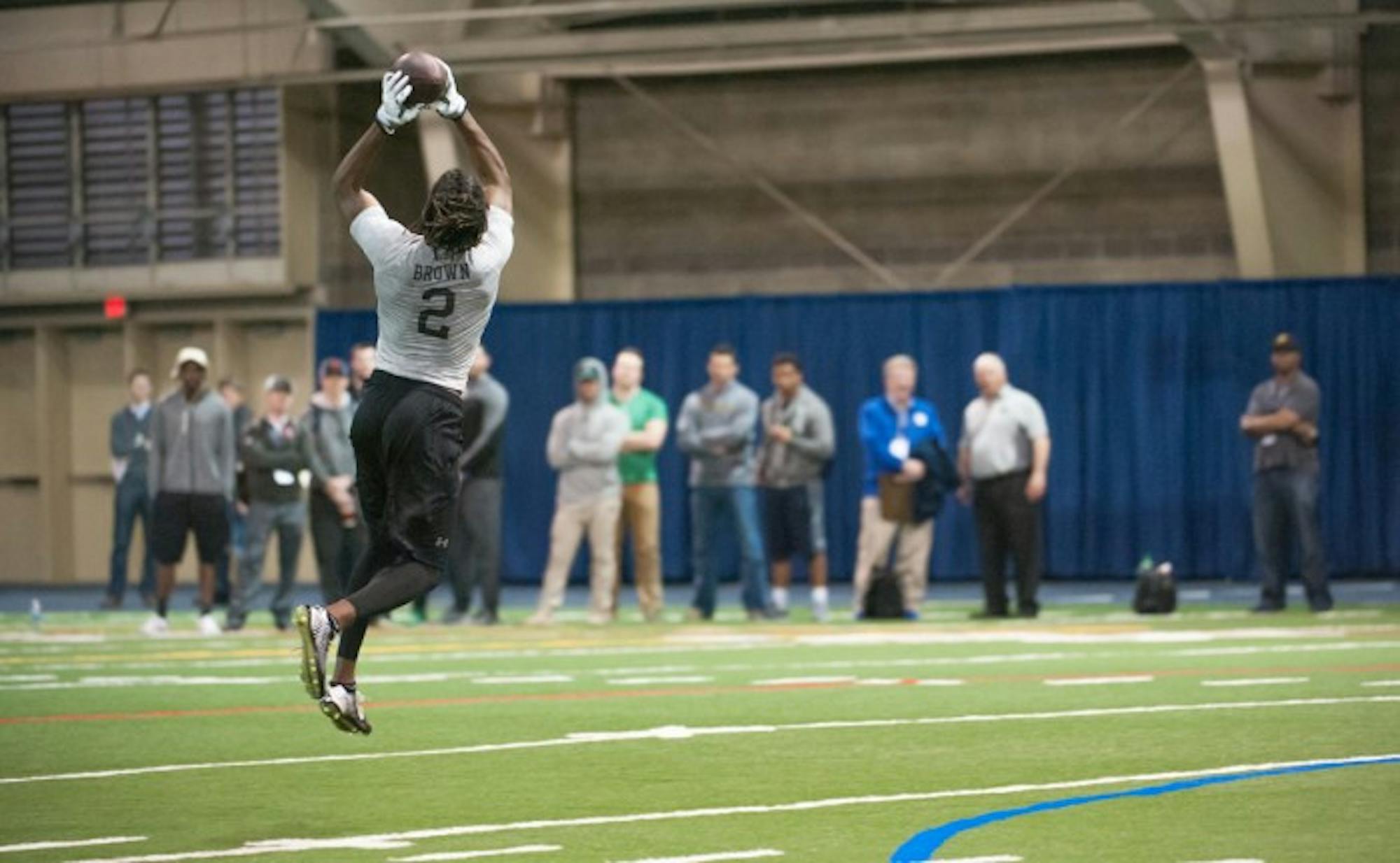 Former Irish receiver Chris Brown leaps to make a catch during Notre Dame’s Pro Day on Thursday at Loftus Sports Complex.