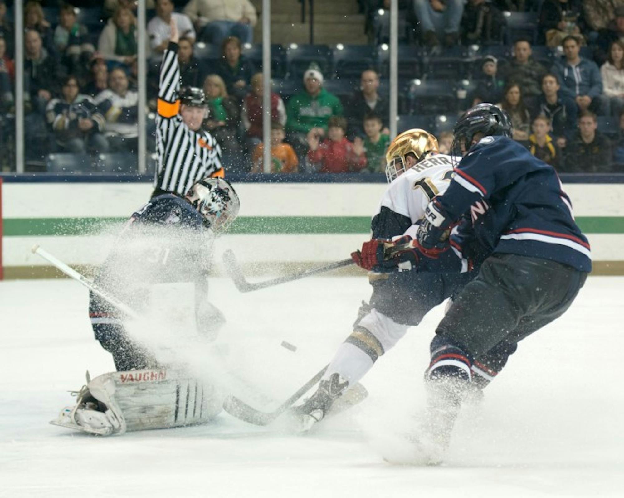 Irish junior left wing Sam Herr takes a shot on goal in a 3-3 overtime tie against Connecticut in the Compton Family Ice Arena on Jan. 16.