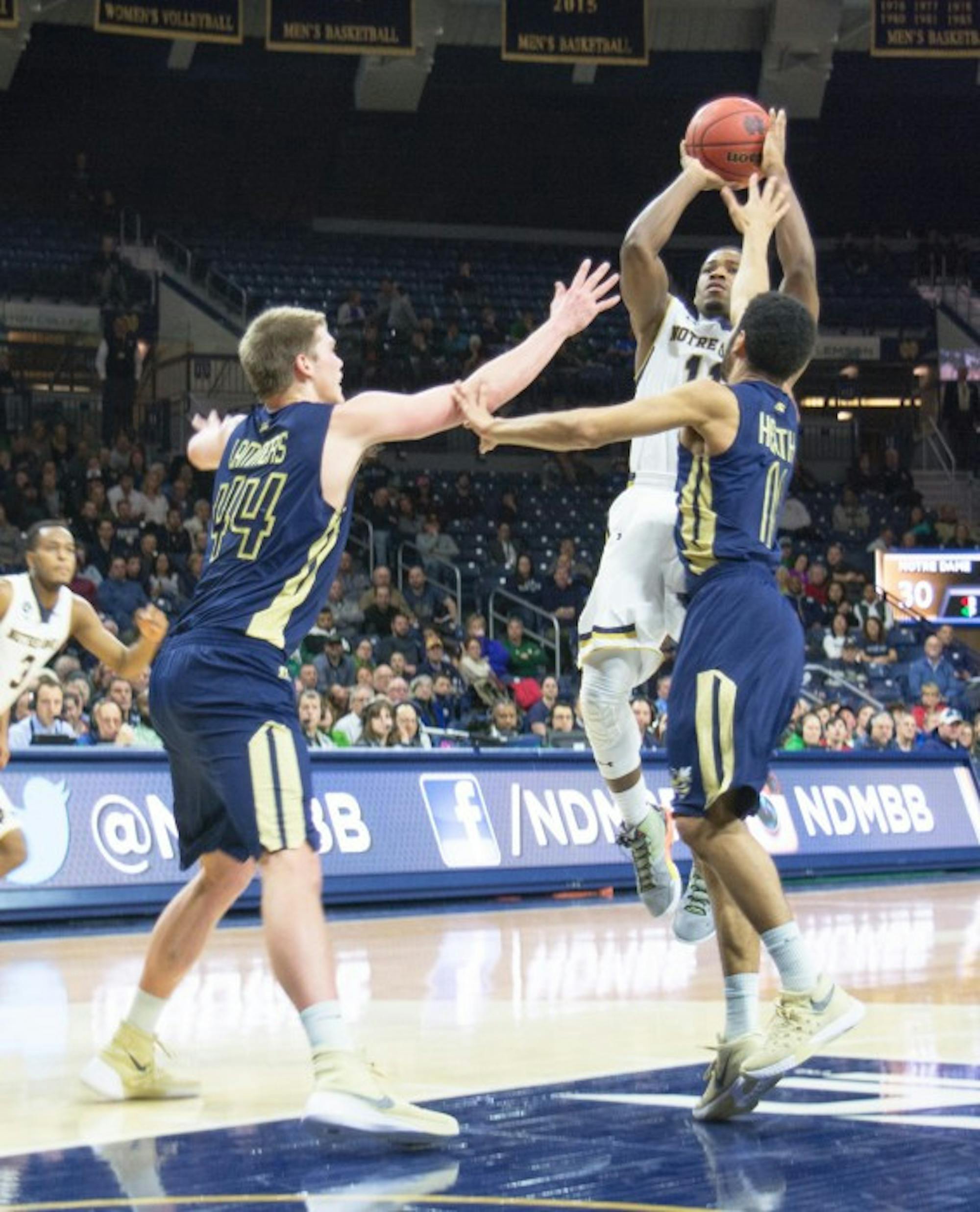 Irish junior guard Demetrius Jackson rises up over two Georgia Tech defenders during Notre Dame’s  72-64 win over the Yellow Jackets on Wednesday. Jackson scored 24 points against Duke on Saturday.