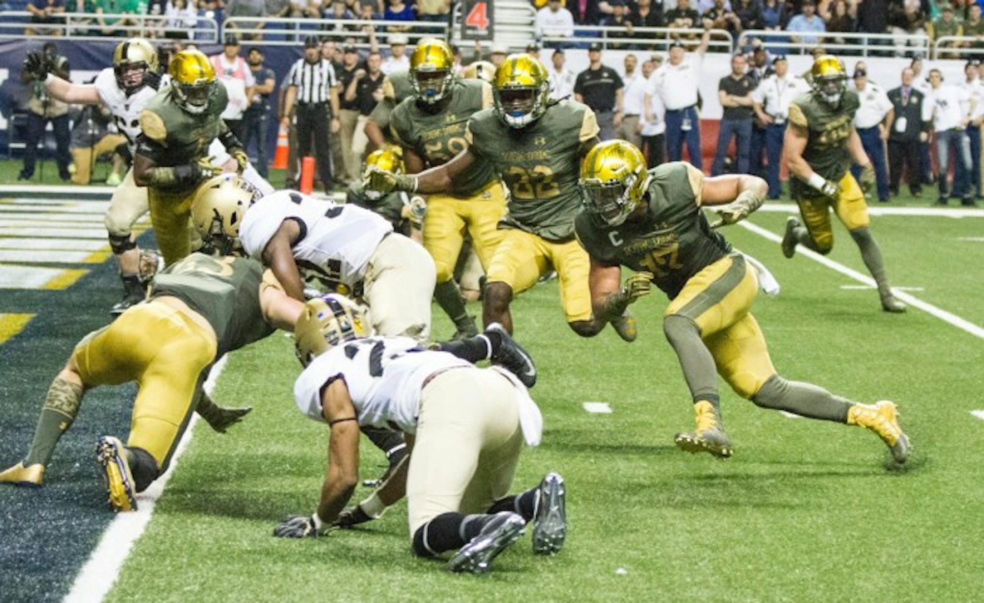 Irish senior linebacker James Onwualu pursues an Army ball carrier near the goal line during Notre Dame’s 44-6 victory over the Black Knights at the Alamodome in San Antonio on Nov. 12. Onwualu started his career at Notre Dame as a receiver, but switched to linebacker during his sophomore season and is now one of Notre Dame’s four senior captains.