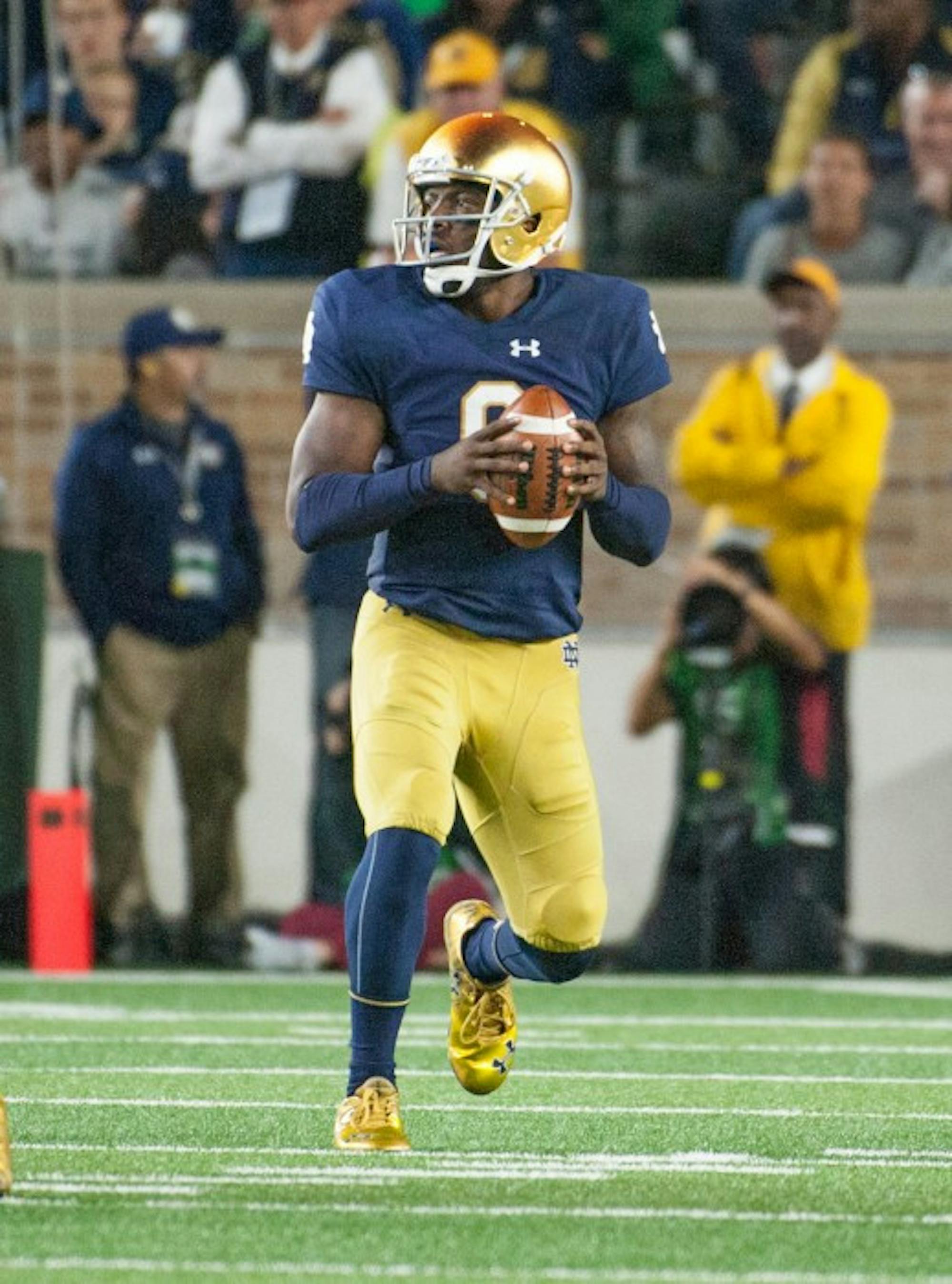 Senior quarterback Malik Zaire drops back to pass during Notre Dame’s 17-10 loss to Stanford on Oct. 15 at Notre Dame Stadium.