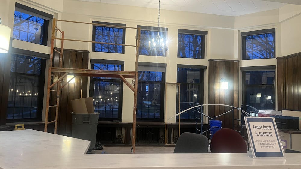 Interior renovations occur around the front desk of Le Mans Hall.jpeg