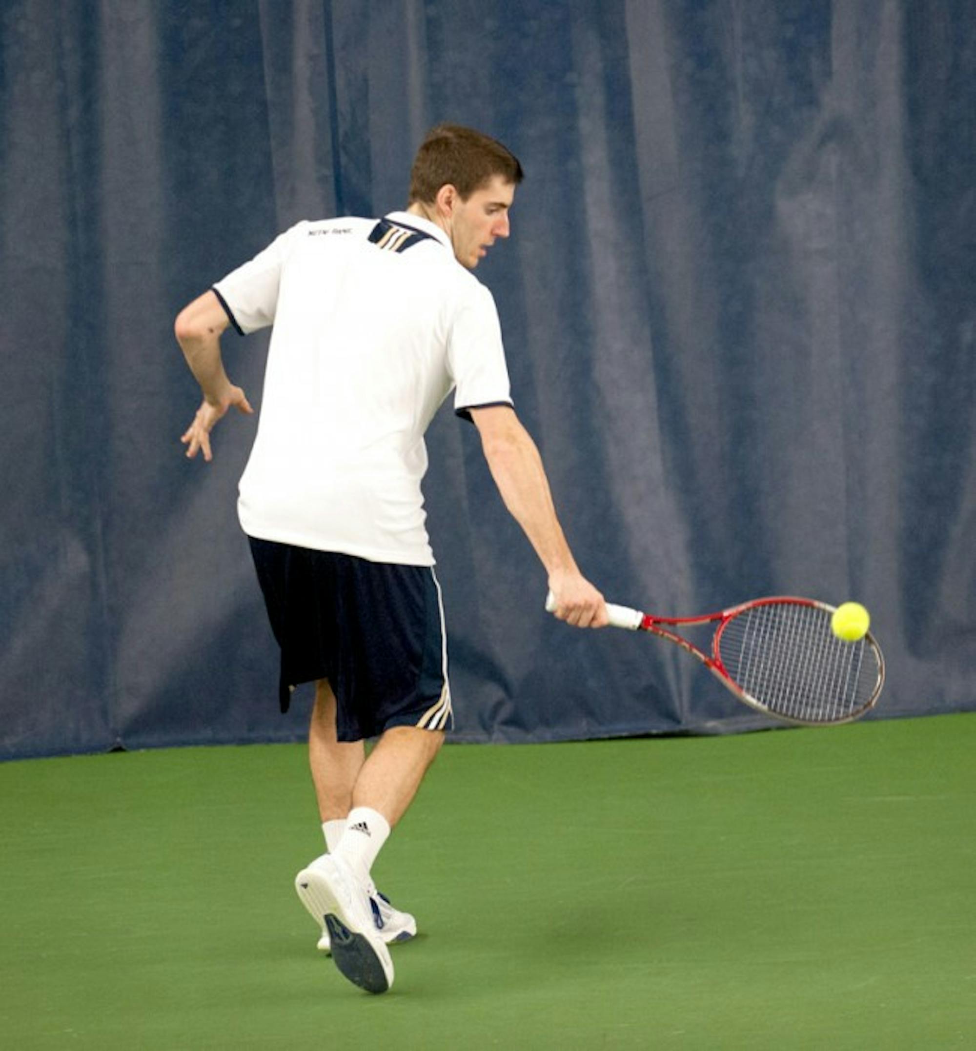 Senior Ryan Bandy reaches for a backhand during a Feb. 28 match against Virginia Tech sophomore Joao Monteiro in Eck Tennis Pavilion. Bandy lost the match, 4-6, 6-1, 6-4.