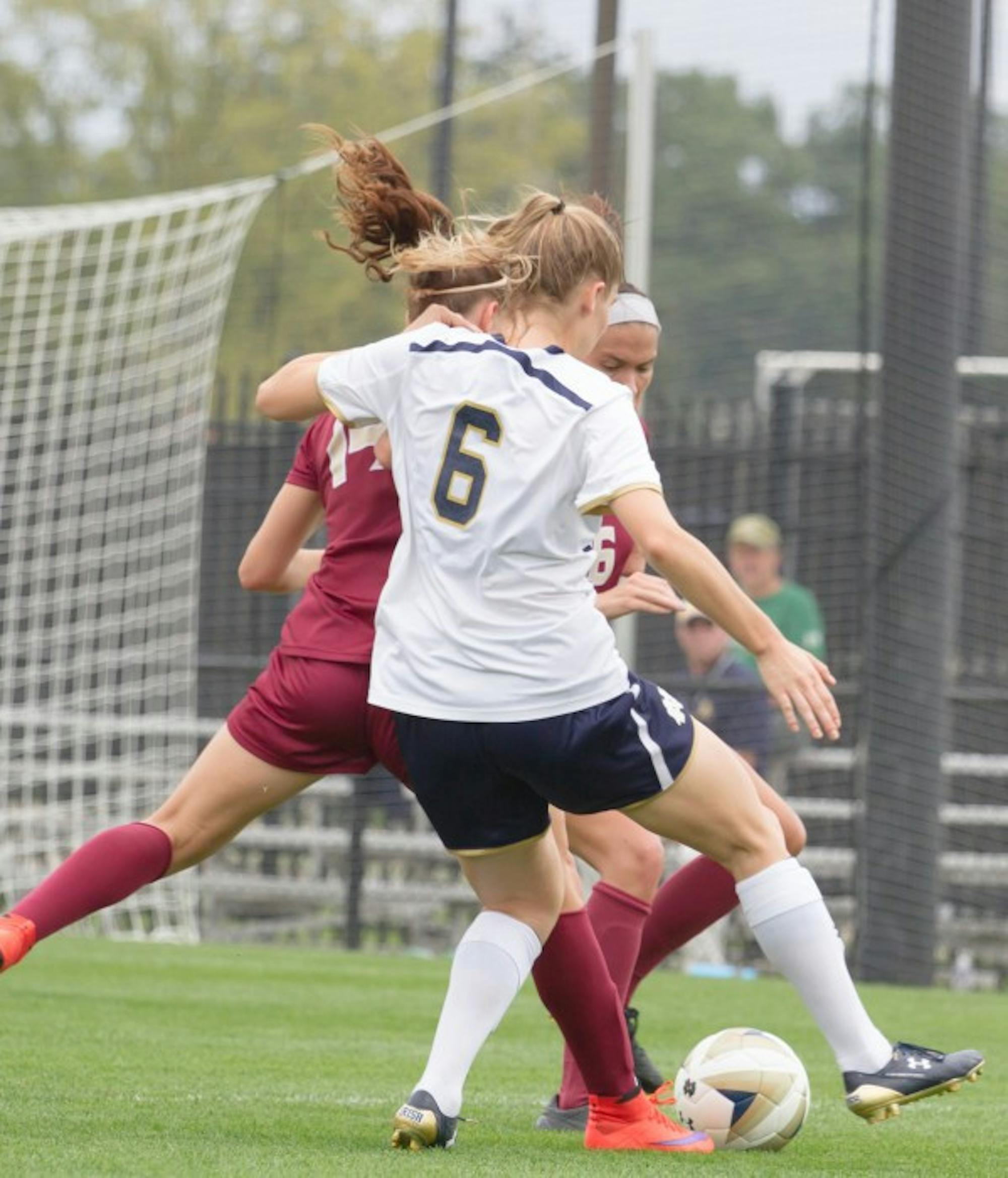 Irish senior forward Anna Maria Gilbertson battles defenders for the ball during Notre Dame’s 1-0 loss to Florida State on Sept. 27.