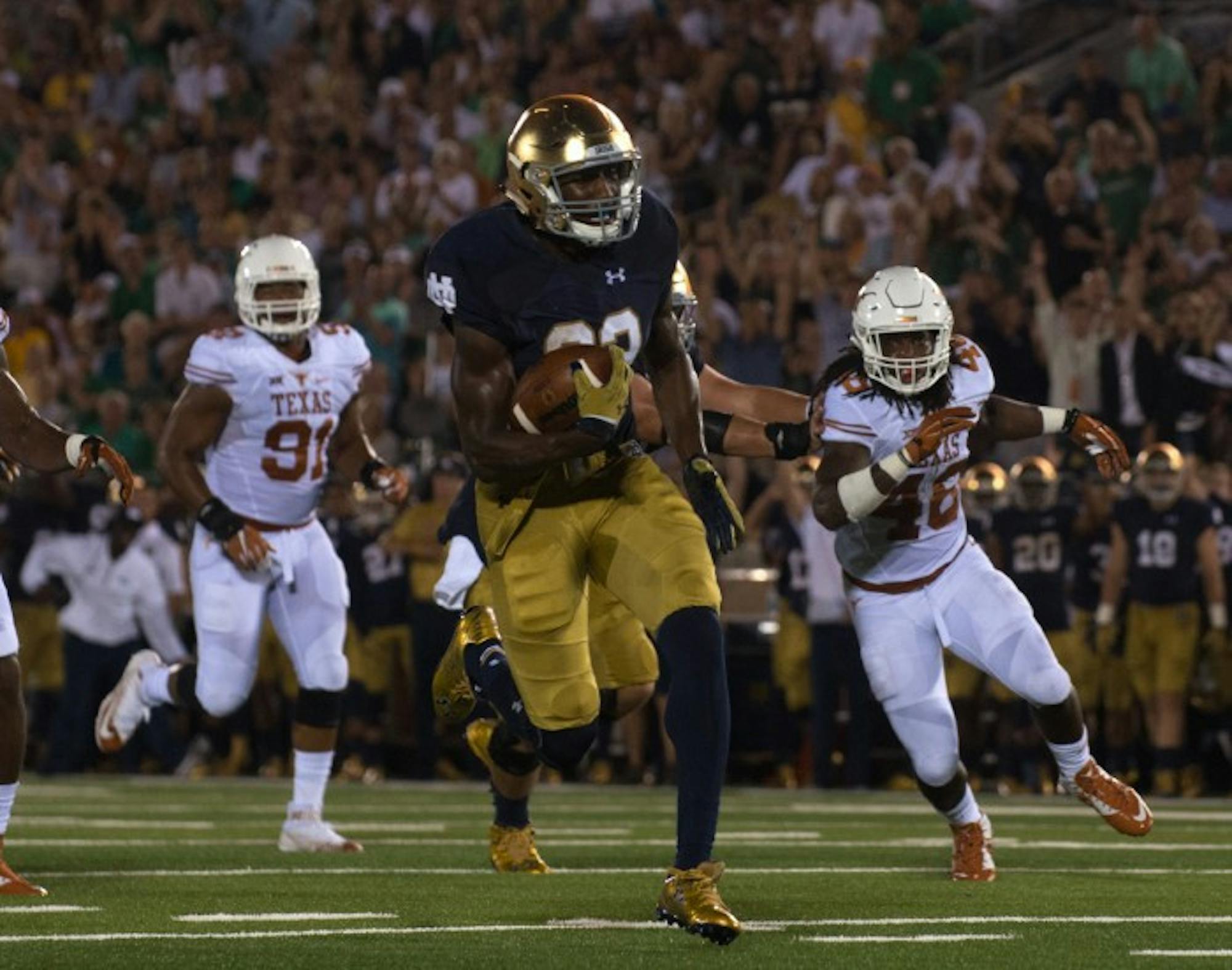 Freshman running back Josh Adams carries the ball during Notre Dame’s 38-3 victory over Texas on Sept. 5 at Notre Dame Stadium.