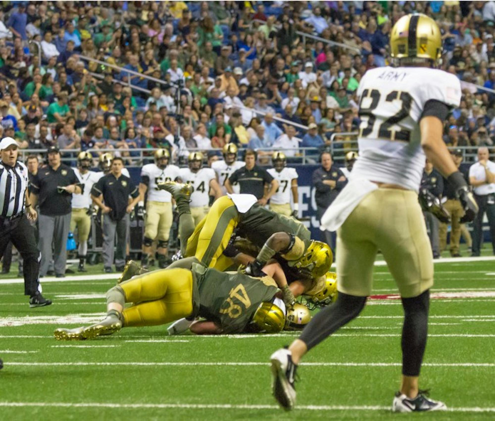 Irish junior linebacker Greer Martini makes a tackle during Notre Dame’s 44-6 victory over Army on Saturday in San Antonio.