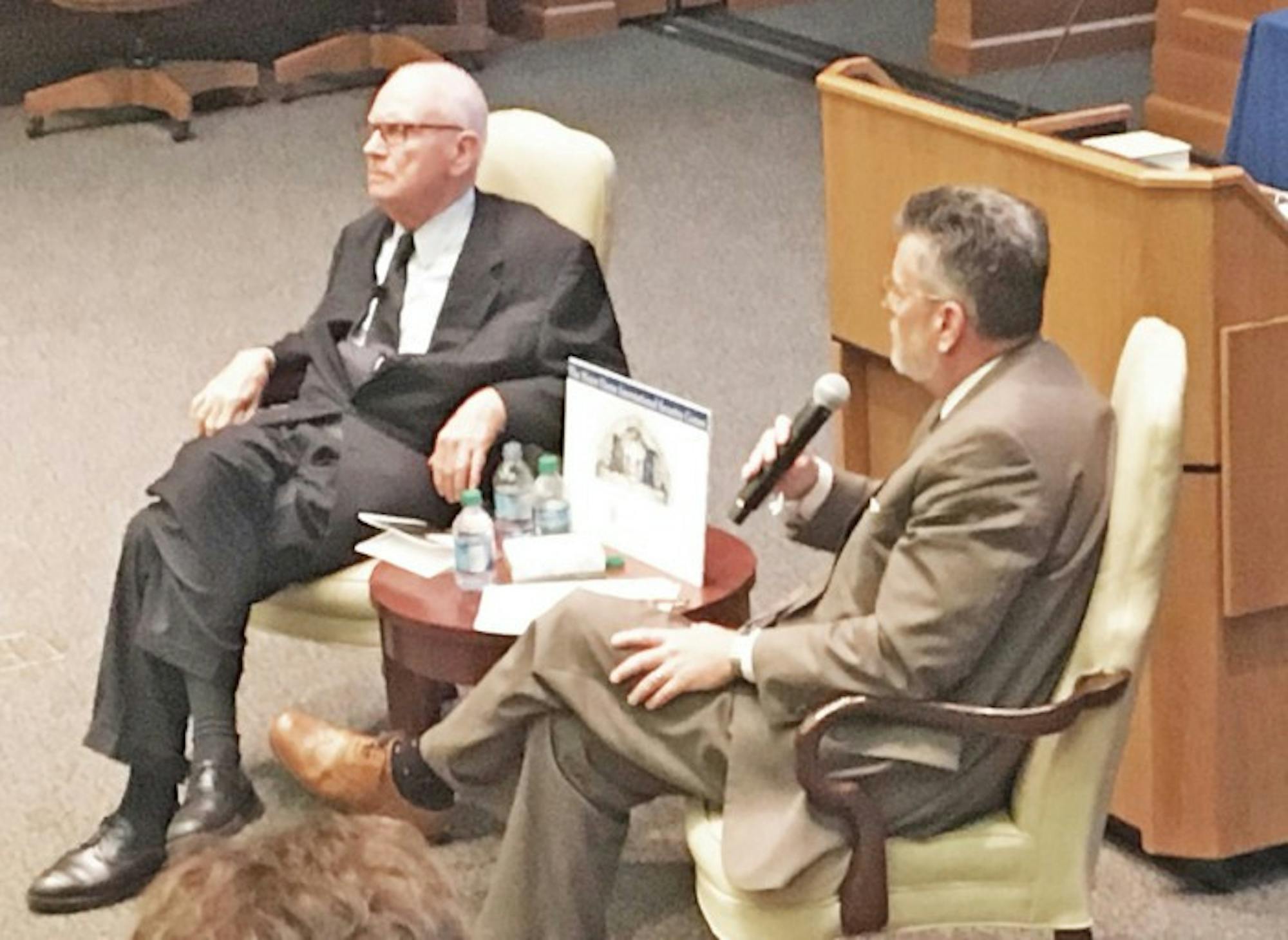 Former Congressman and vice-chair of the 9/11 Commission Lee Hamilton, left, reflected on issues such as terrorism threats and national security with political science professor Michael Desch, right, on Thursday.