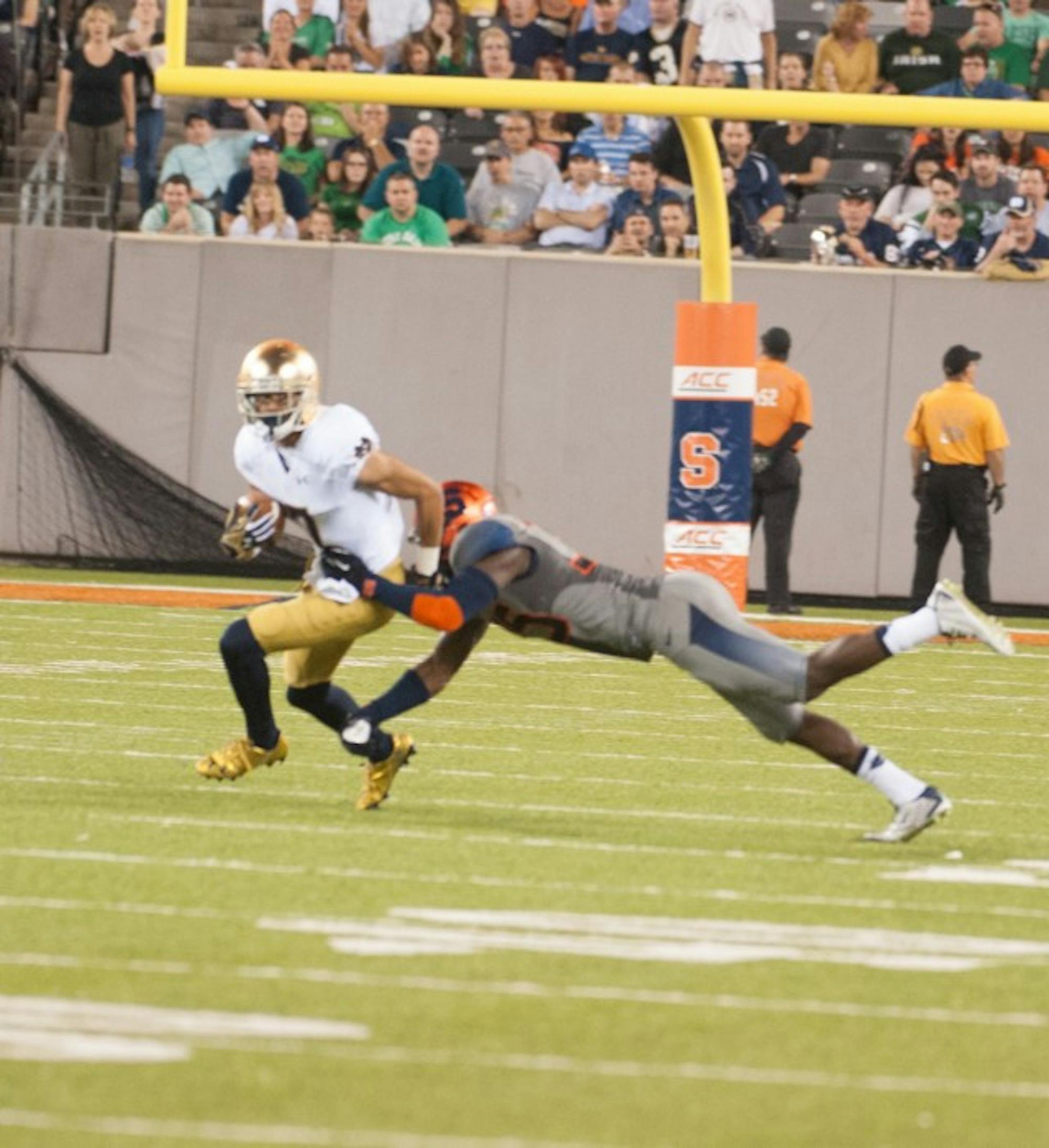 Irish sophomore Will Fuller breaks a tackle Saturday against     Syracuse at MetLife Stadium during Notre Dame’s 31-15 win.