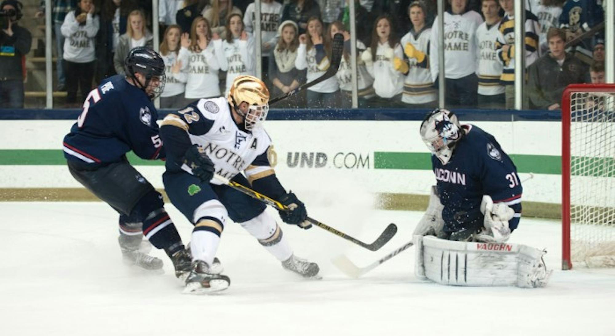 Irish junior left wing Sam Herr crashes the net during Notre Dame’s 3-3 tie with UConn on Jan. 16 at Compton Family Ice Arena. Herr has tallied eight goals and six assists on the season for the Irish.